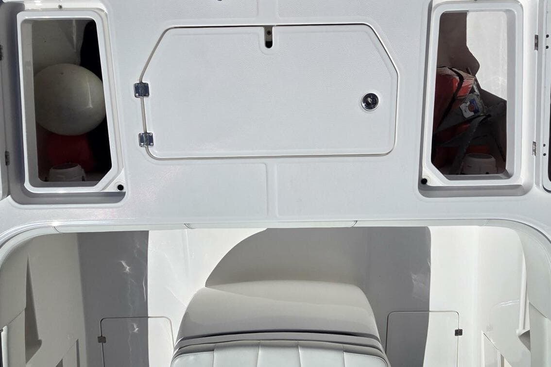 2020 Invincible 35 Catamaran interior storage compartments and seating area.