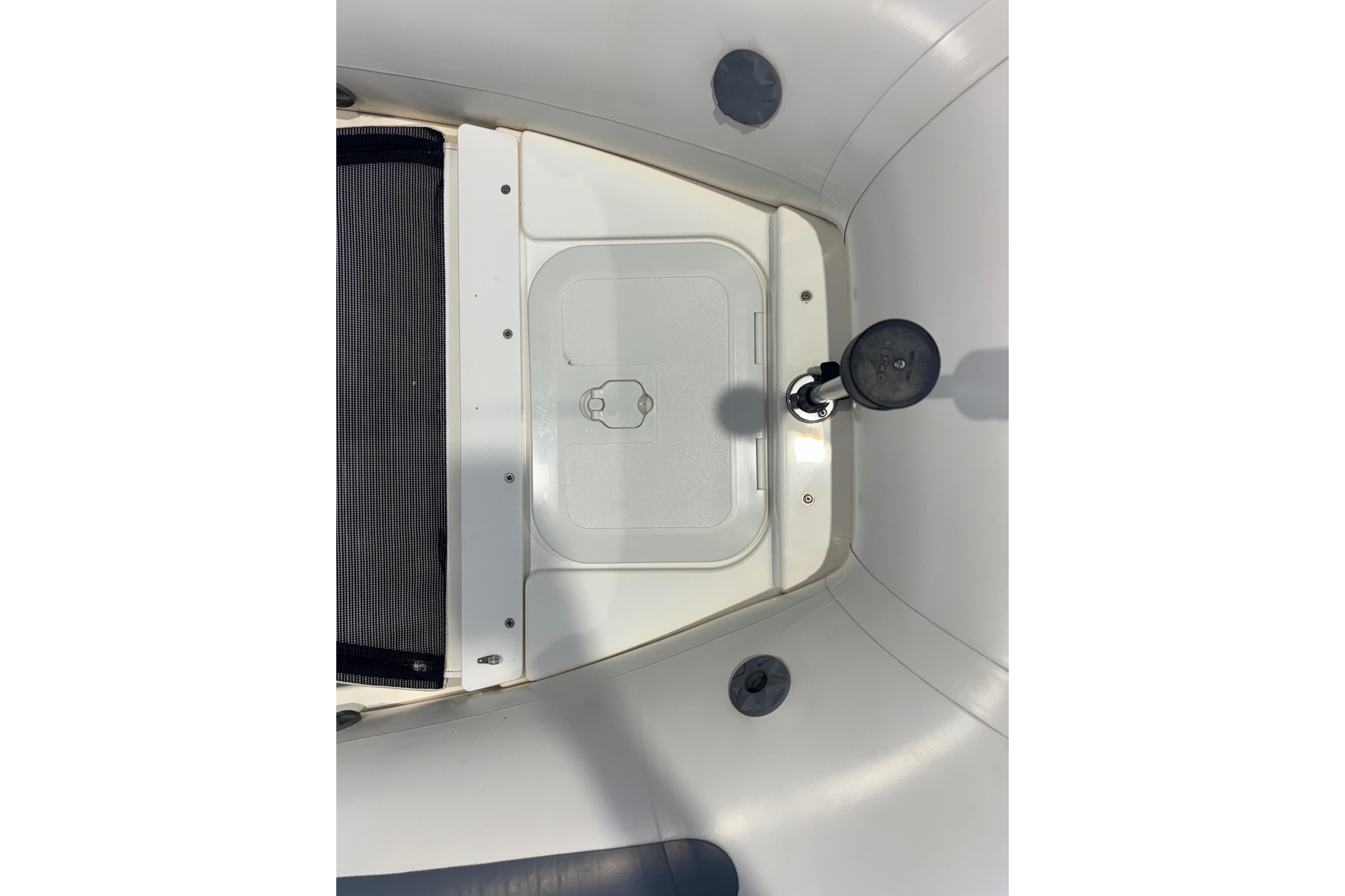 2018 Williams Jet Tenders Sportjet 345 interior detail, featuring storage compartment and seating area.