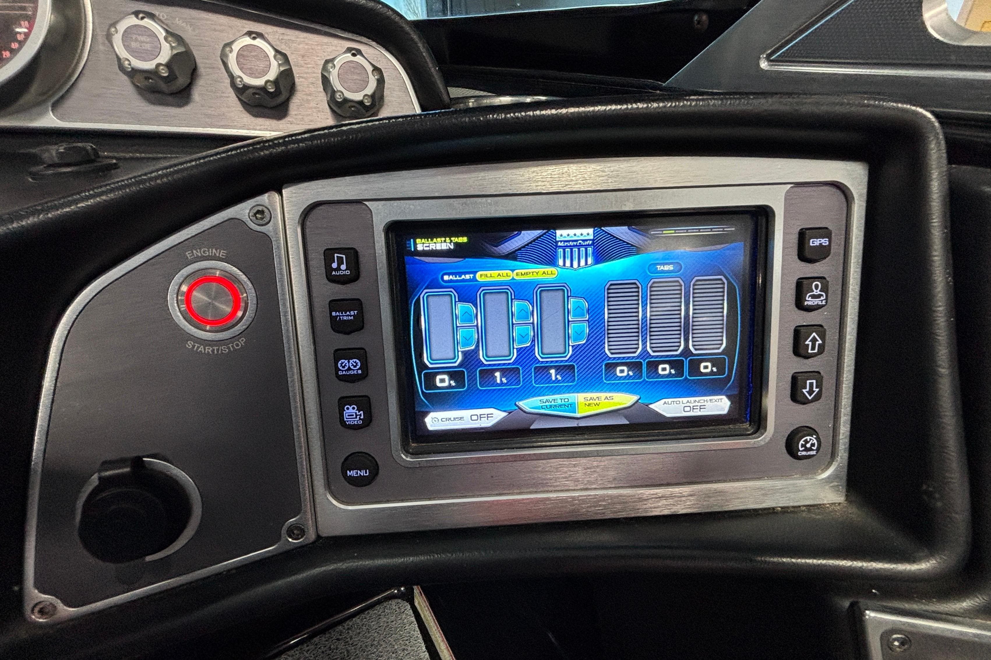 2017 MasterCraft X46 dashboard with touchscreen controls and engine start button.