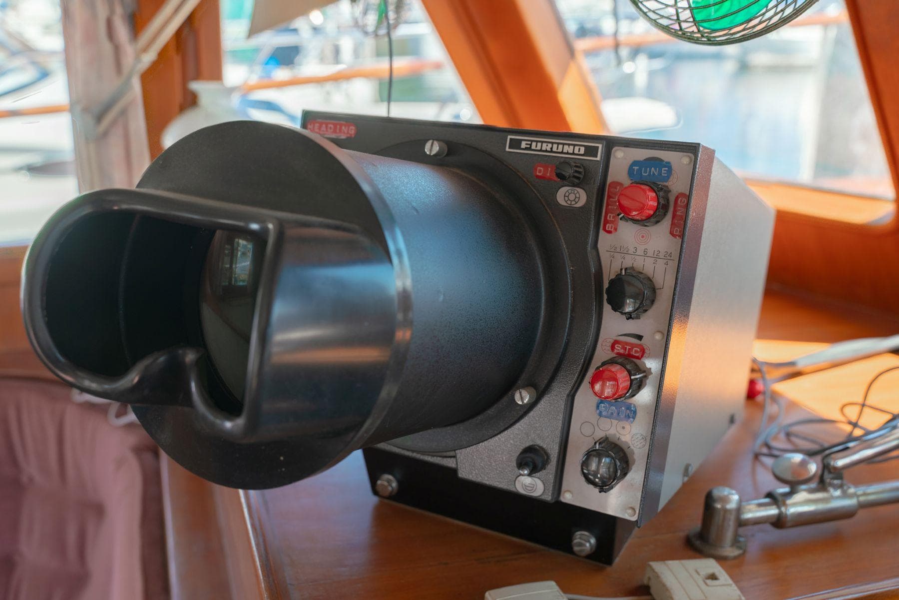 Radar equipment inside a 1980 Grand Mariner 36 Tri-Cabin Trawler, featuring control knobs and display.