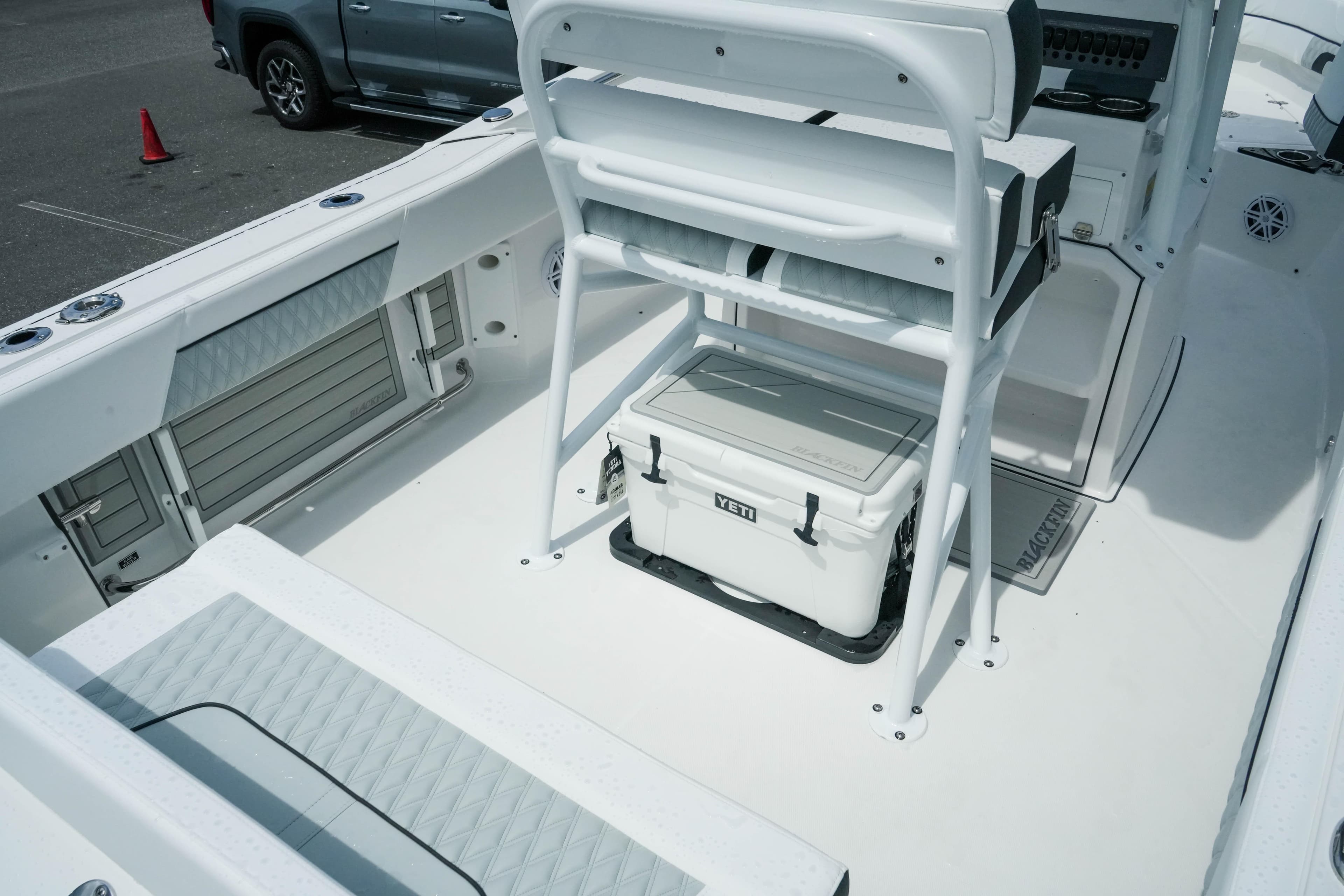 2026 Blackfin 222 CC boat interior with seating and Yeti cooler.