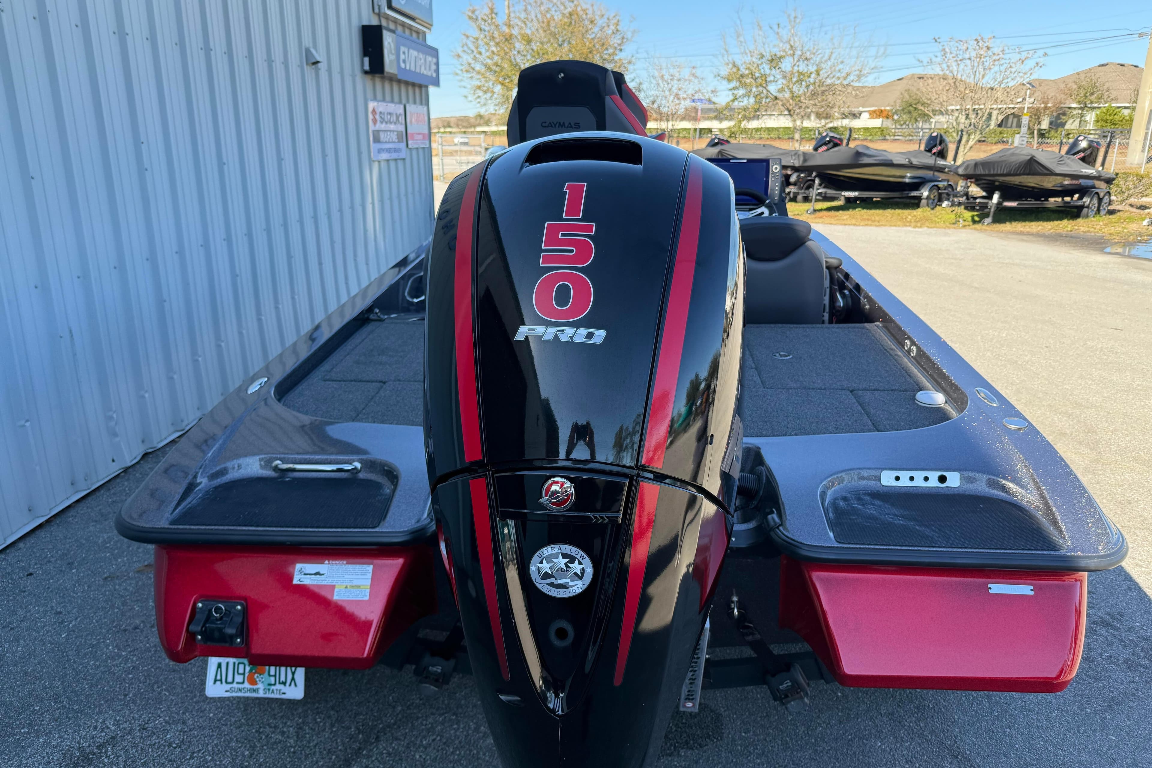 2022 Caymas CX 18 SS boat with 150 Pro engine, parked outdoors.