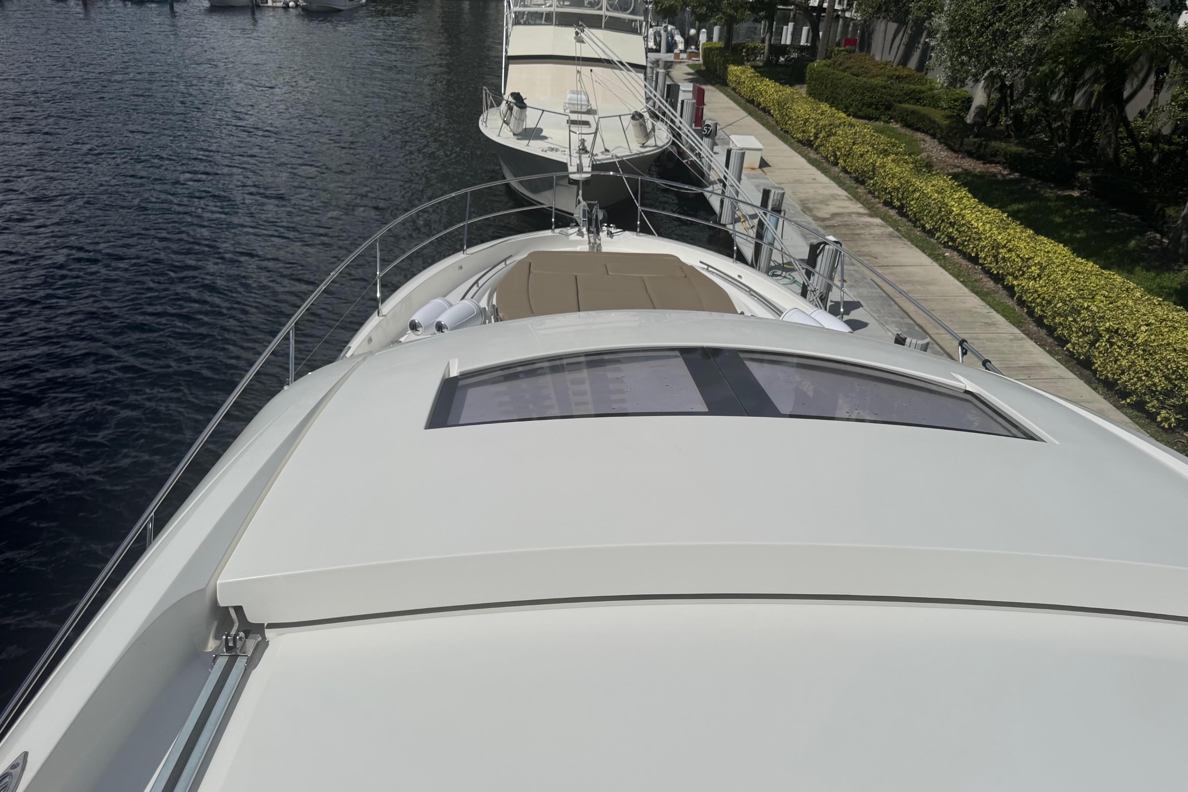 2013 Prestige 550 S yacht docked, showcasing sleek design and spacious deck.