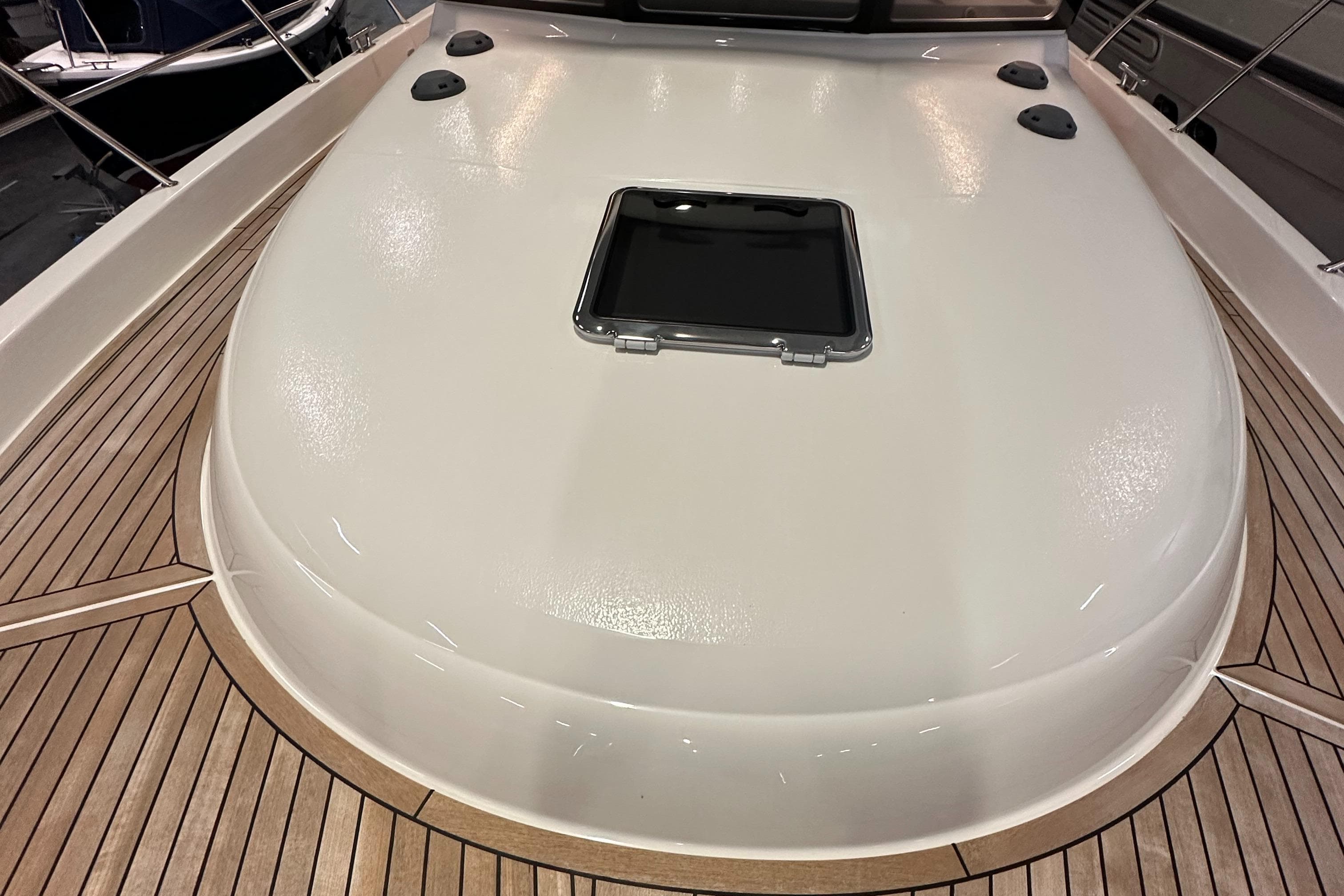 2024 Viknes 1080 boat deck with sleek design and wooden accents.