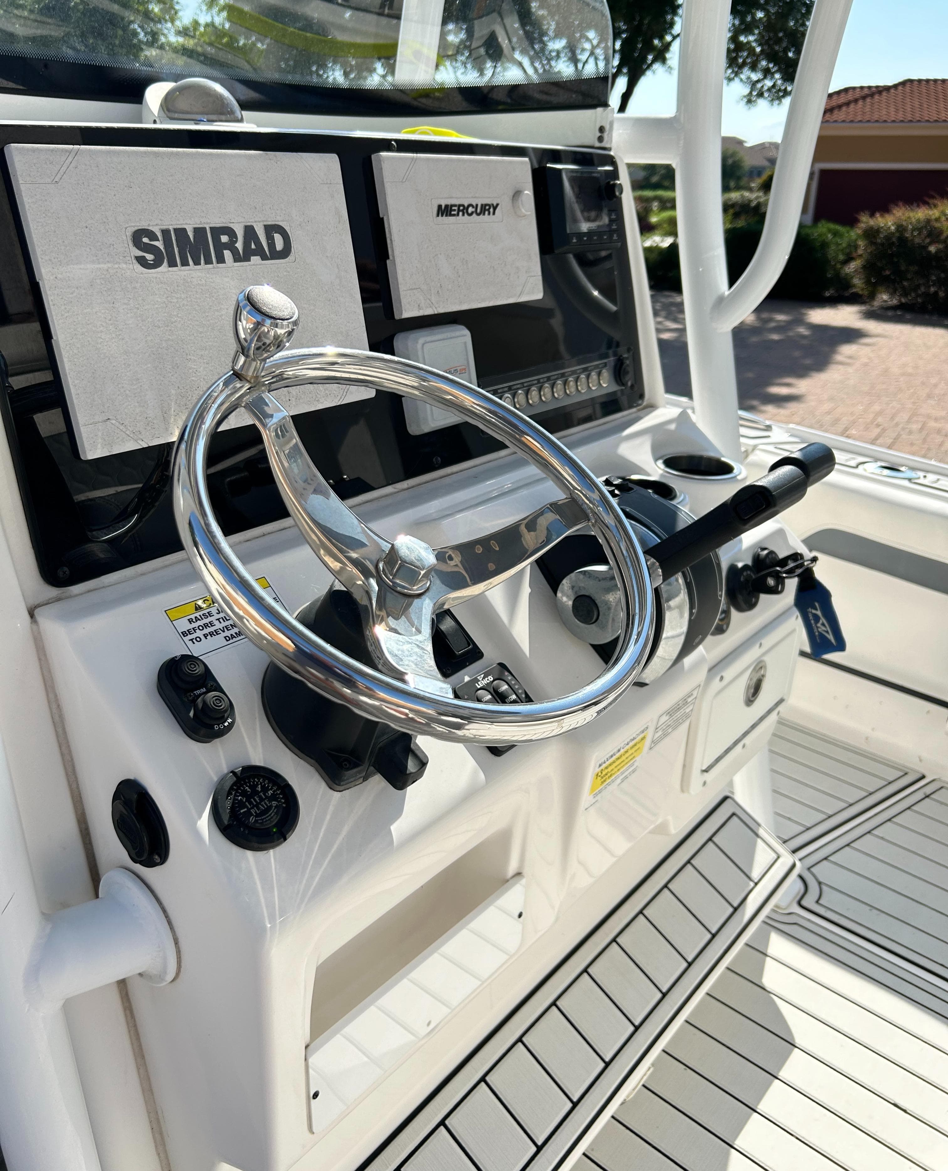 2018 Tidewater 2700 Carolina Bay boat console with Simrad and Mercury controls.