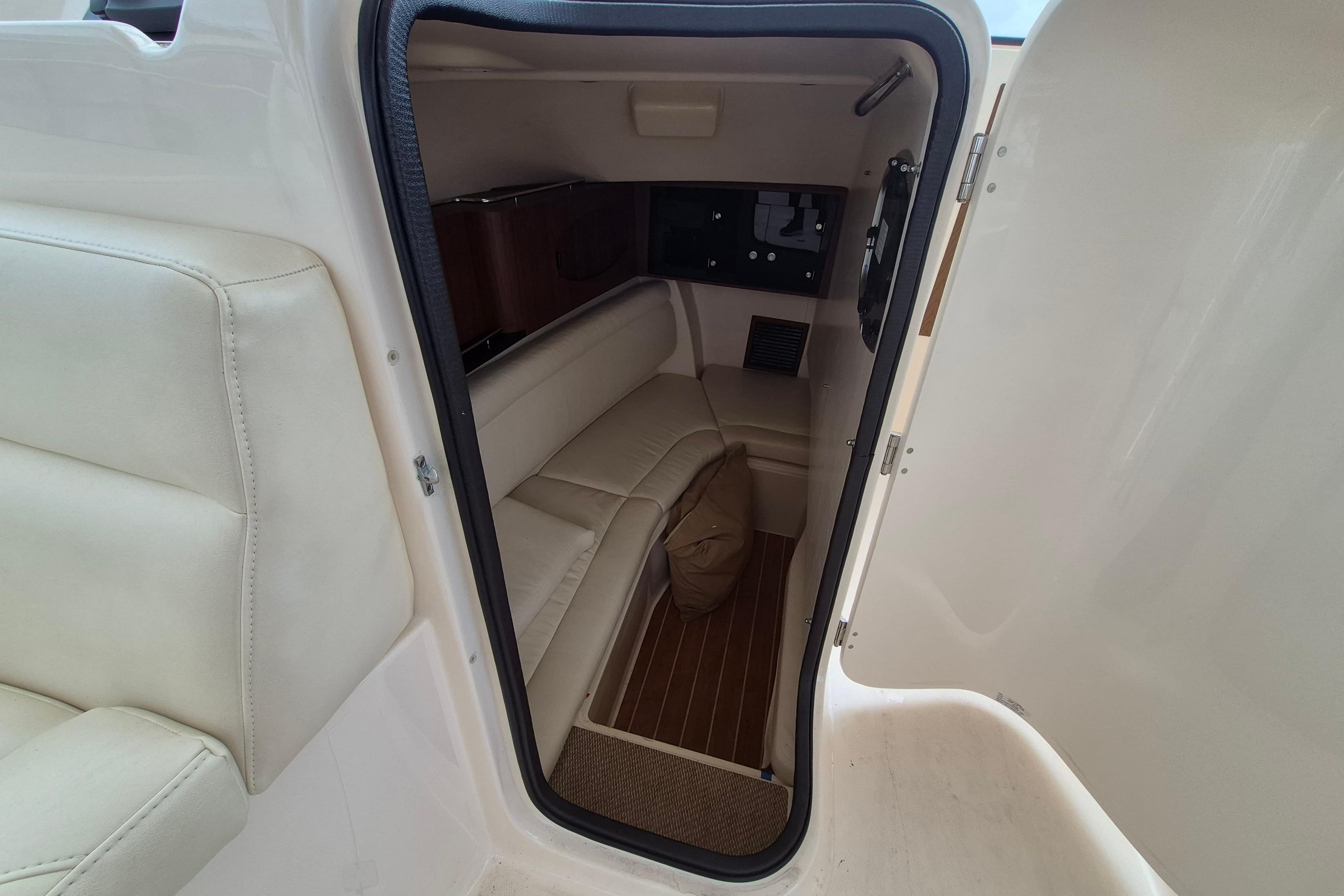 Interior cabin of 2022 Grady-White Freedom 335 boat, featuring comfortable seating and modern design.