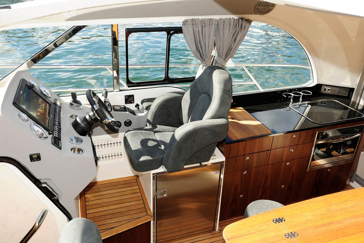 Manufacturer Provided Image: Interior of Marex 375 yacht, 2026 model, featuring helm and kitchenette.