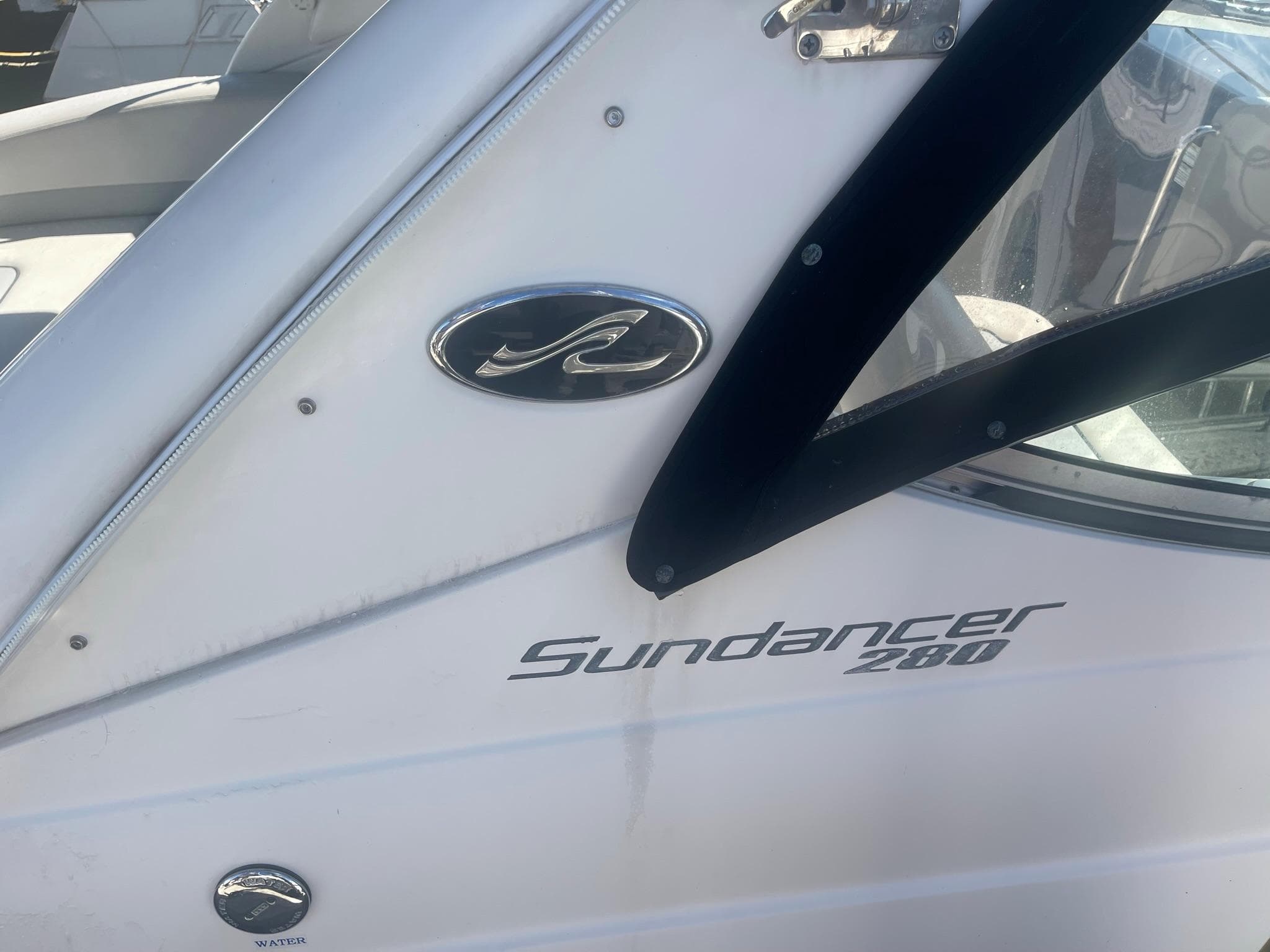 Sea Ray Sundancer 280 boat, 2011 model, close-up of logo.