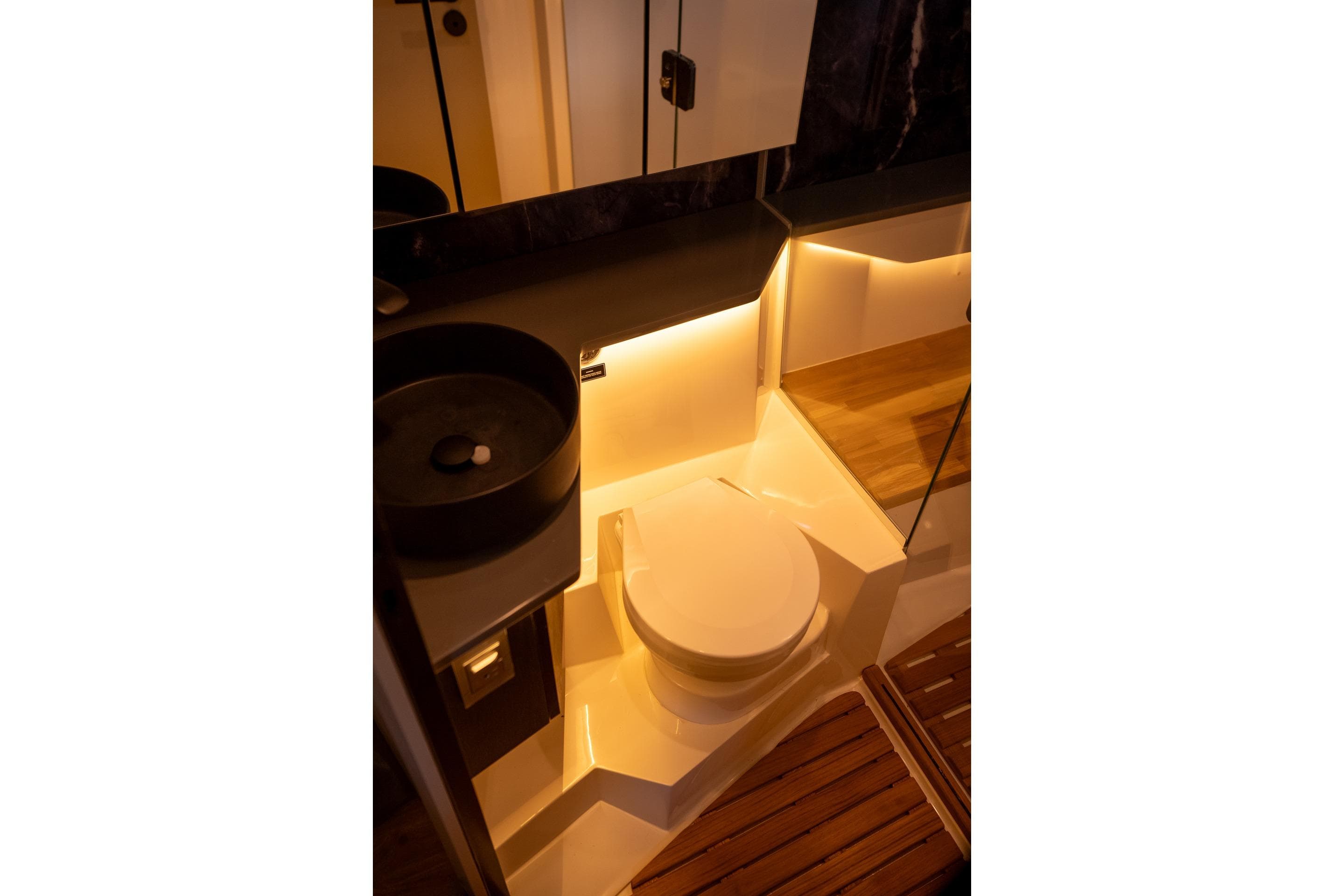 Luxurious bathroom in 2026 Hanover 447 model yacht with modern lighting and sleek design.