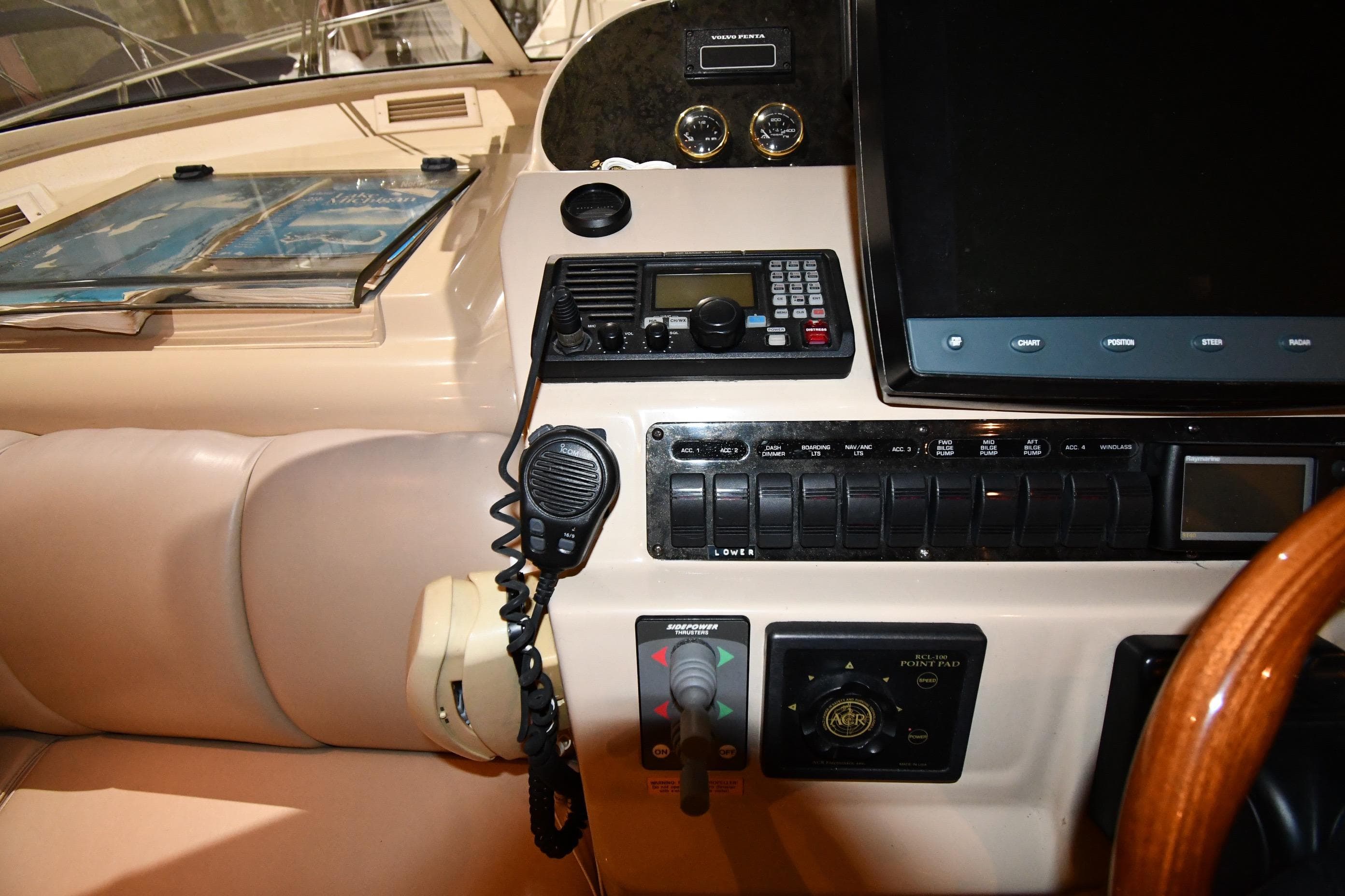 2003 Cruisers Yachts 5000 Sedan Sport helm with navigation controls and communication equipment.