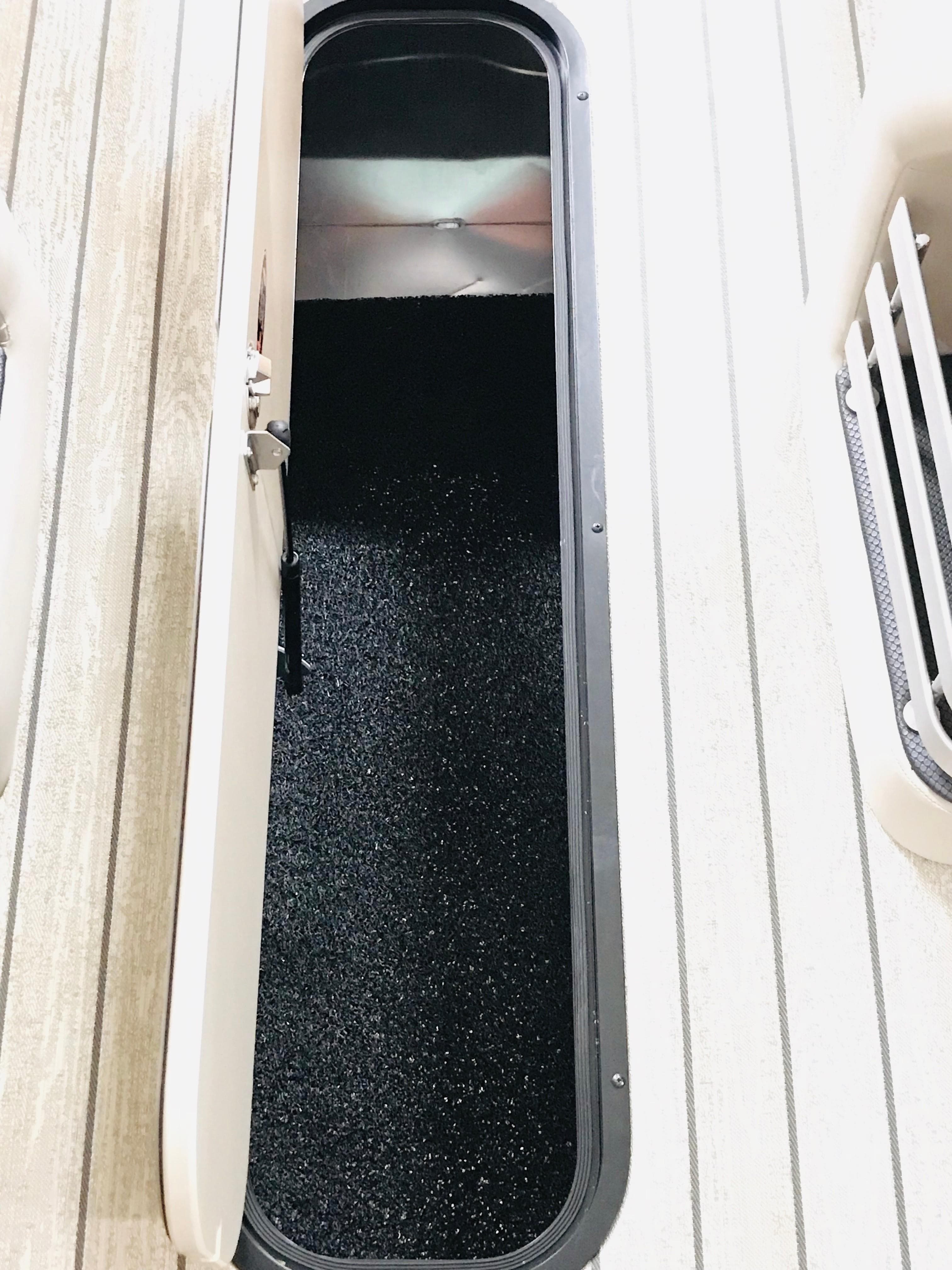 2024 Harris 250 Grand Mariner V10 400 boat storage compartment.