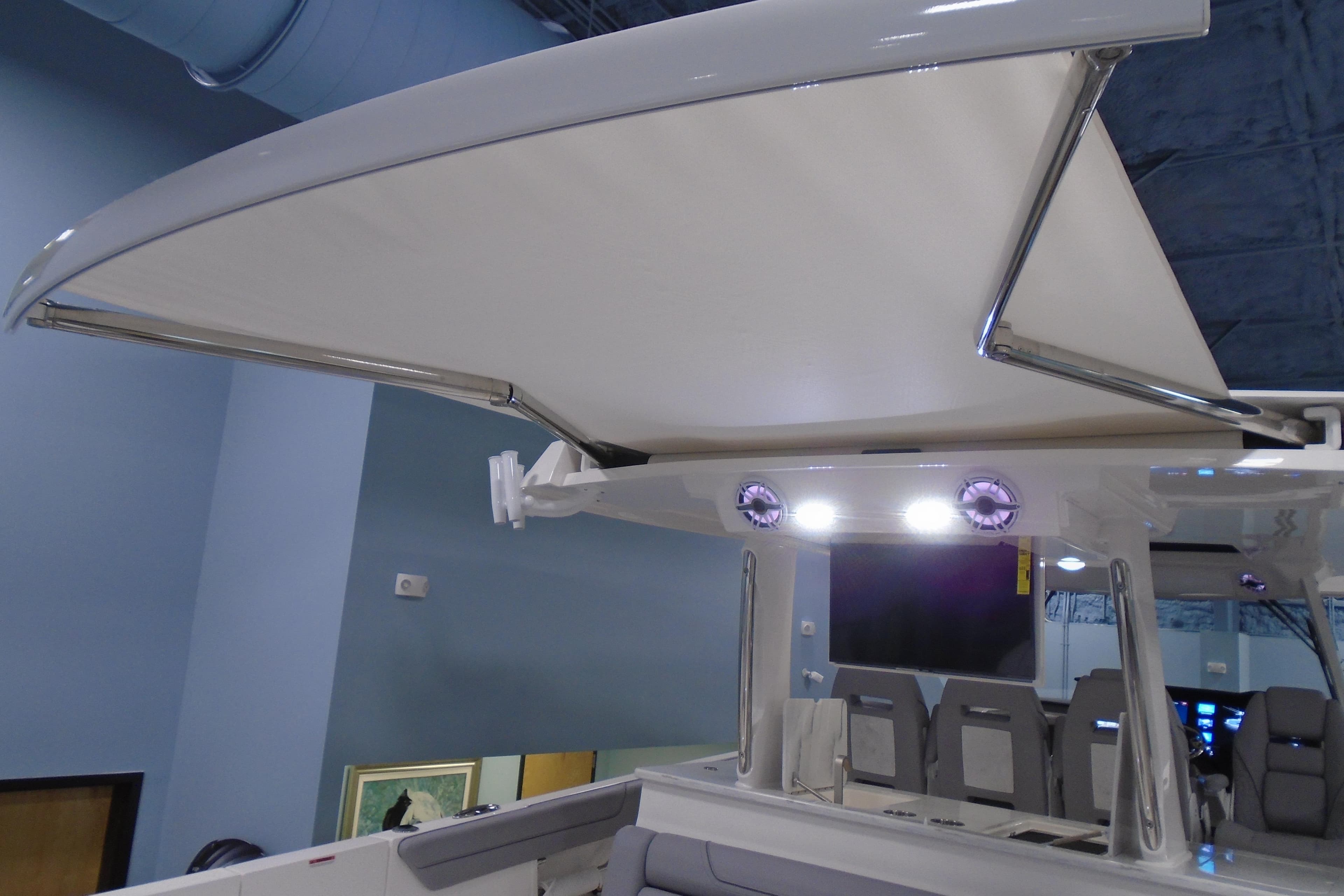 2026 Regal 38 SAV boat with retractable canopy and modern seating.