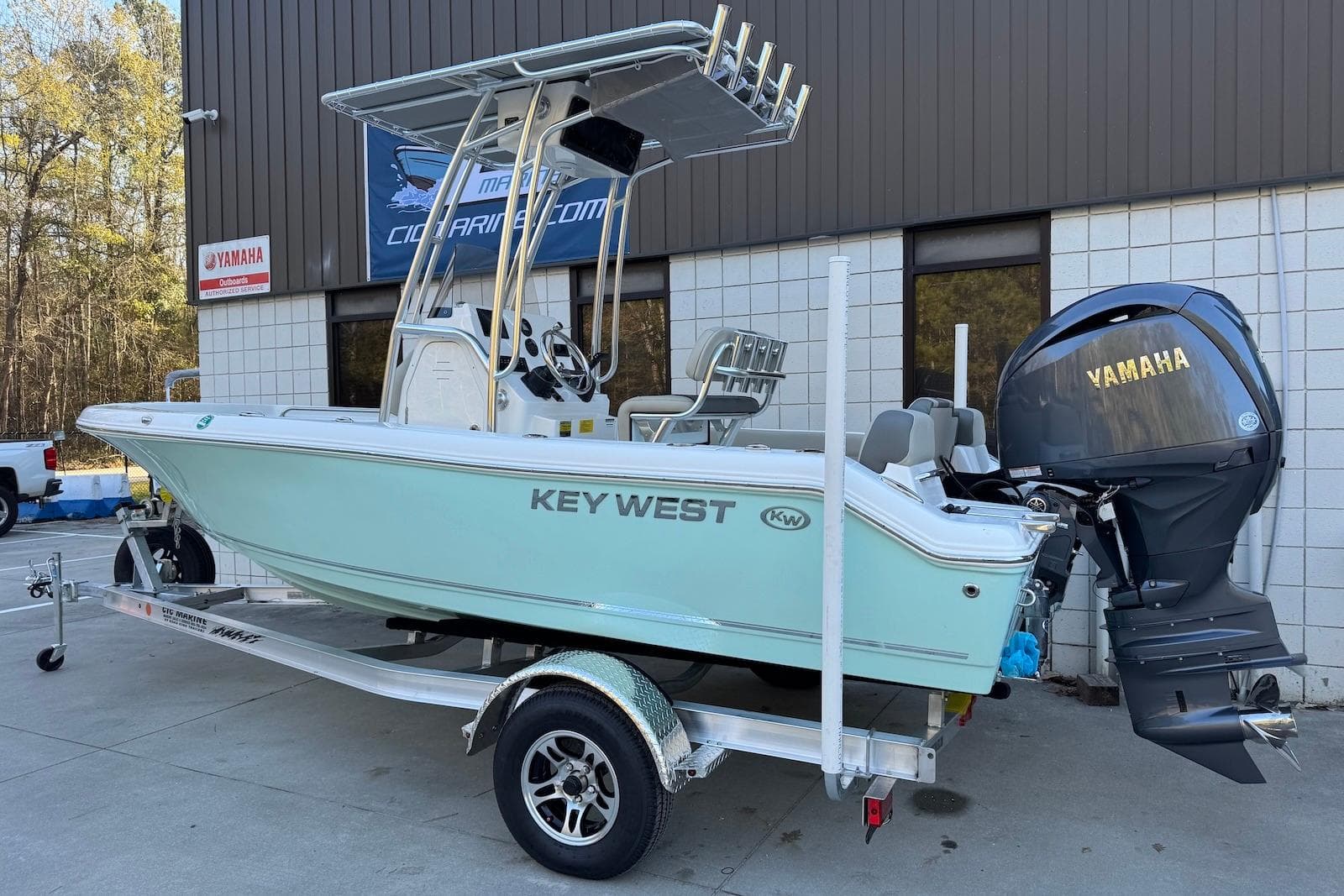 2026 Key West 189 FS boat with Yamaha engine on trailer, parked outside.