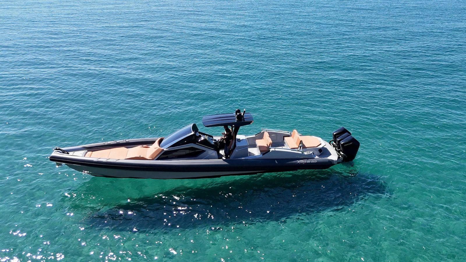 DNA 46 boat 2025 model cruising on clear blue water.