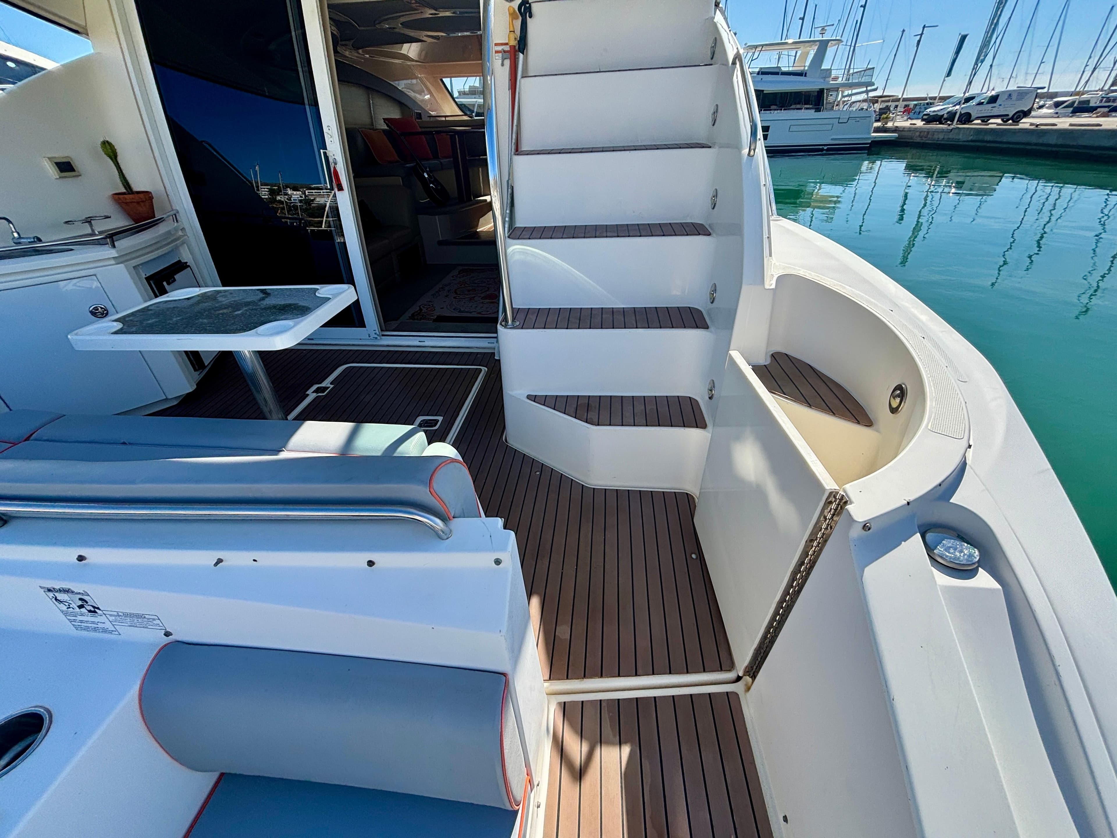 2007 Cruisers Yachts 447 Sport Sedan, featuring elegant deck and seating area by the marina.