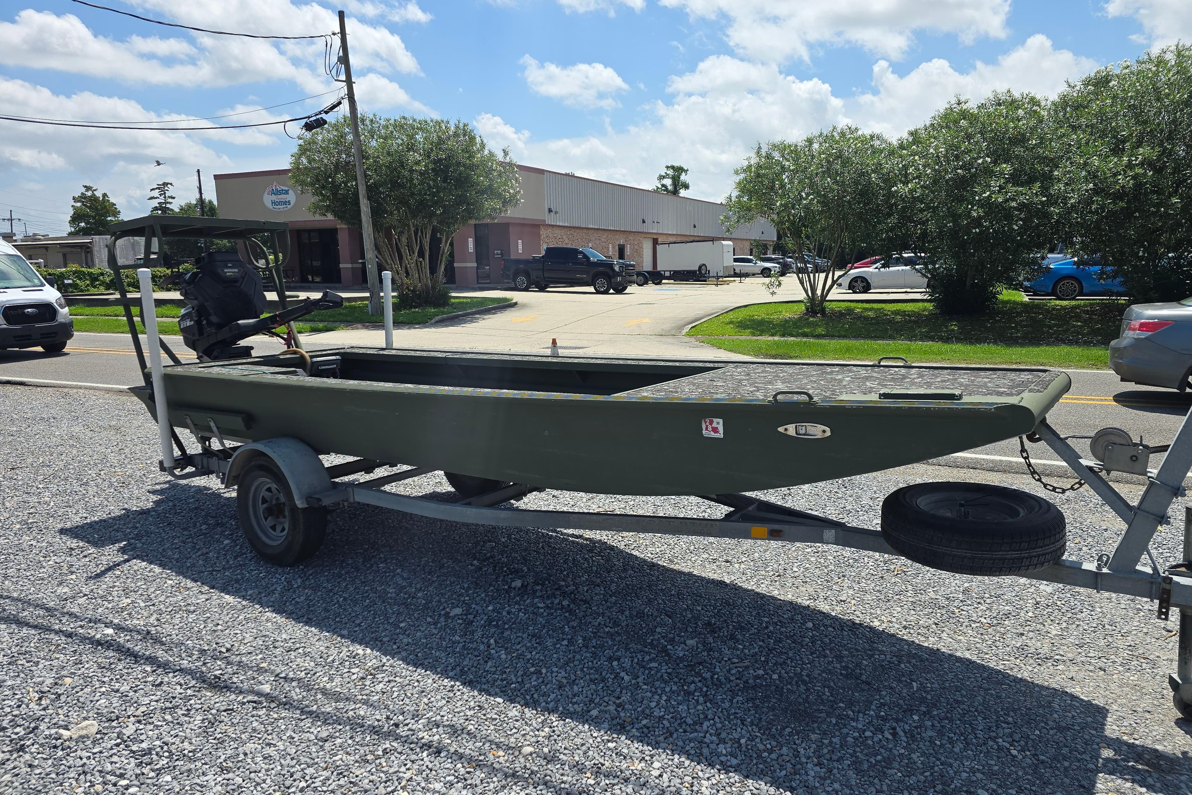 2015 Gator Tail 1854 boat on trailer in parking lot, sunny day.