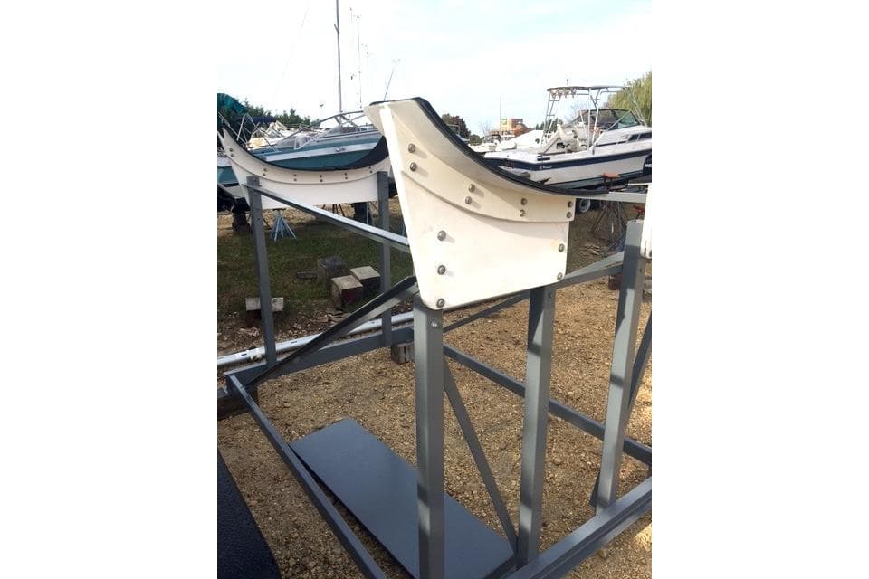 Boat cradle for Wraceboats GP26, 2015 model, on a gravel surface.