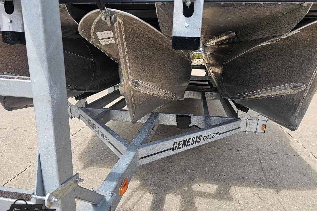 2024 Avalon Excalibur Quad Lounge on Genesis trailer, showcasing pontoon undercarriage.
