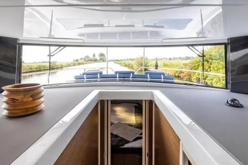 Interior view of 2026 Delphia 11 Flylounge yacht, showcasing sleek design and spacious layout.