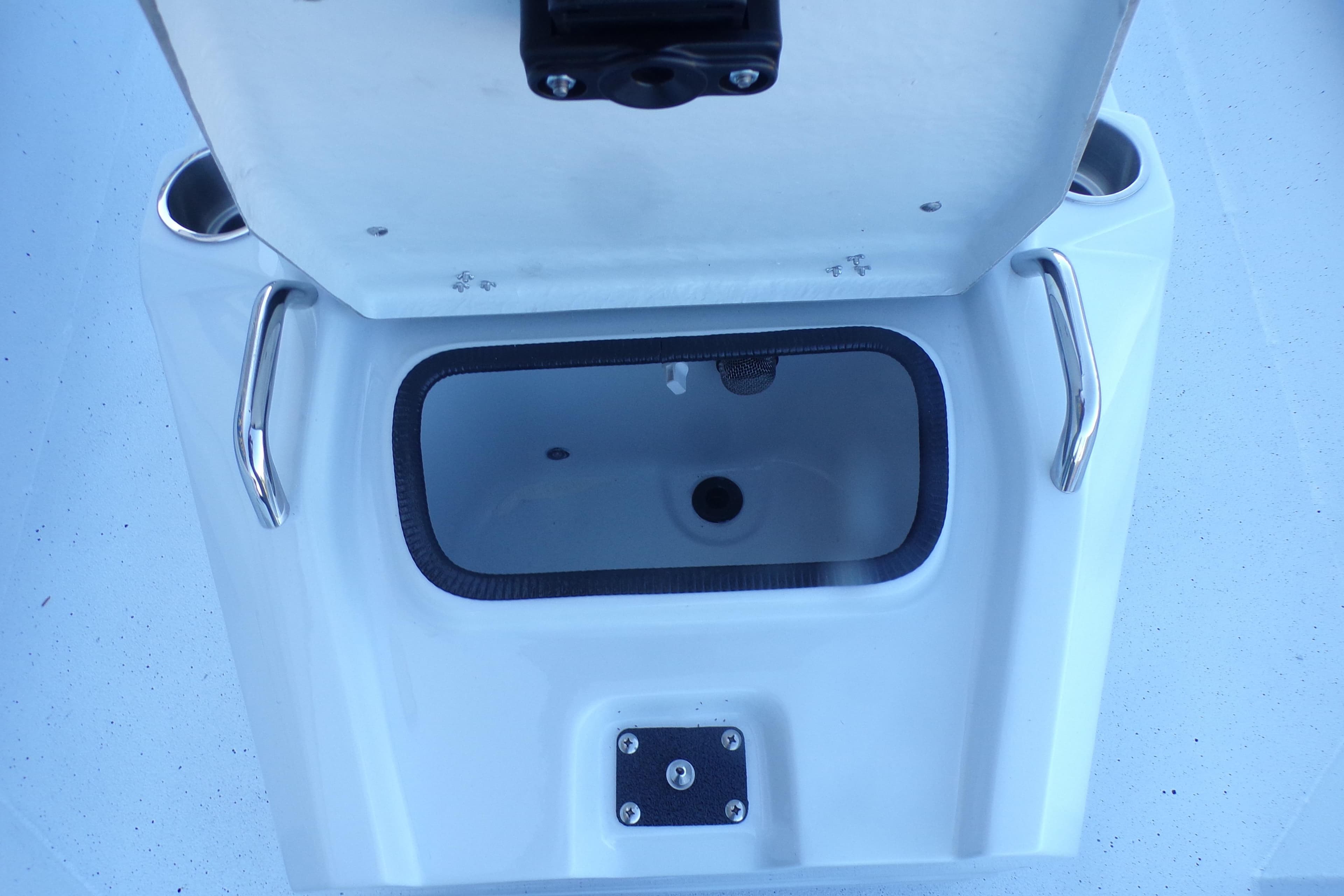 Open storage compartment on 2026 Xpress H20B Bay boat with stainless steel handles.