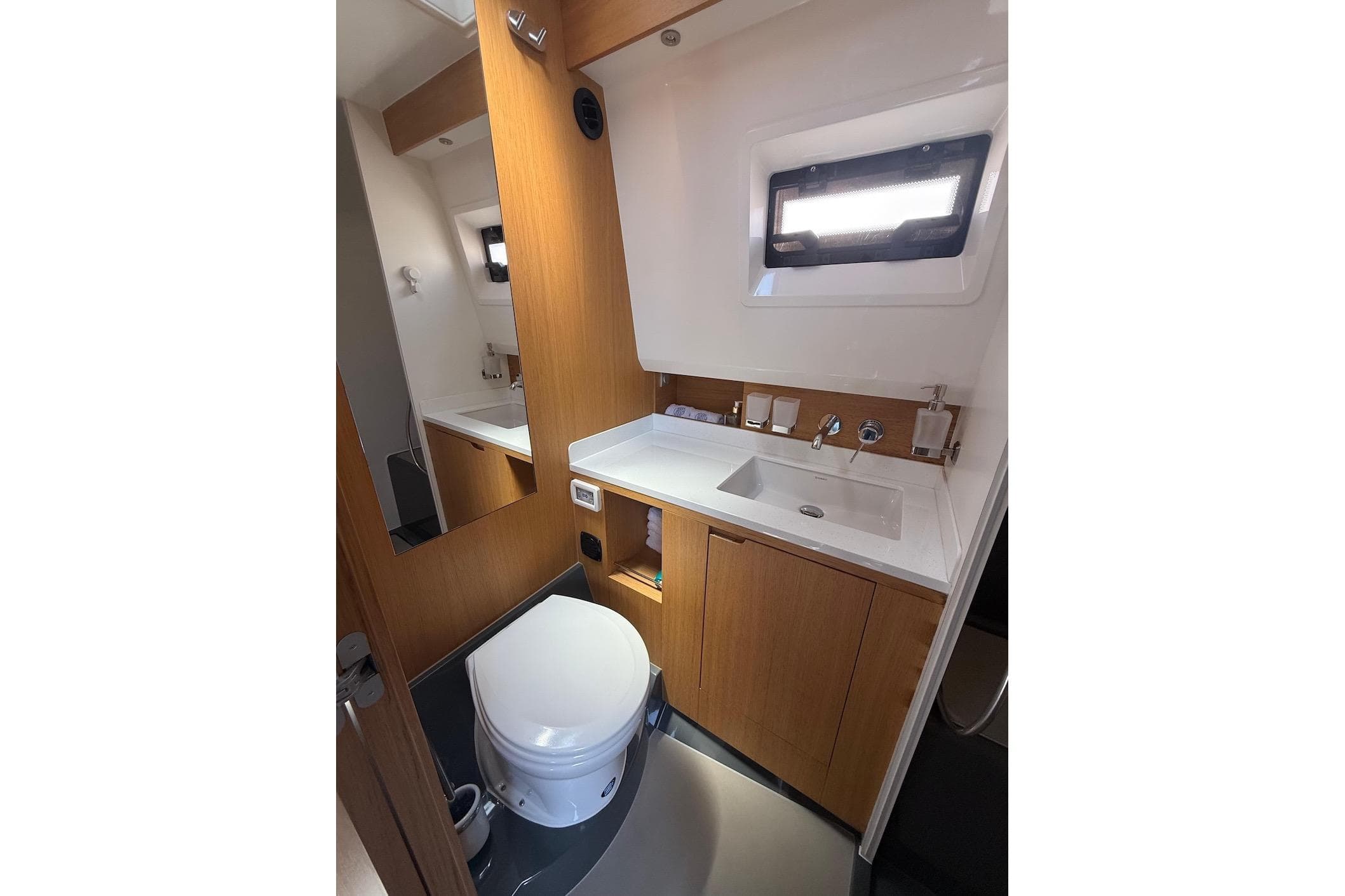 Luxurious bathroom interior of 2021 Windy SR44 SX yacht with modern fixtures.