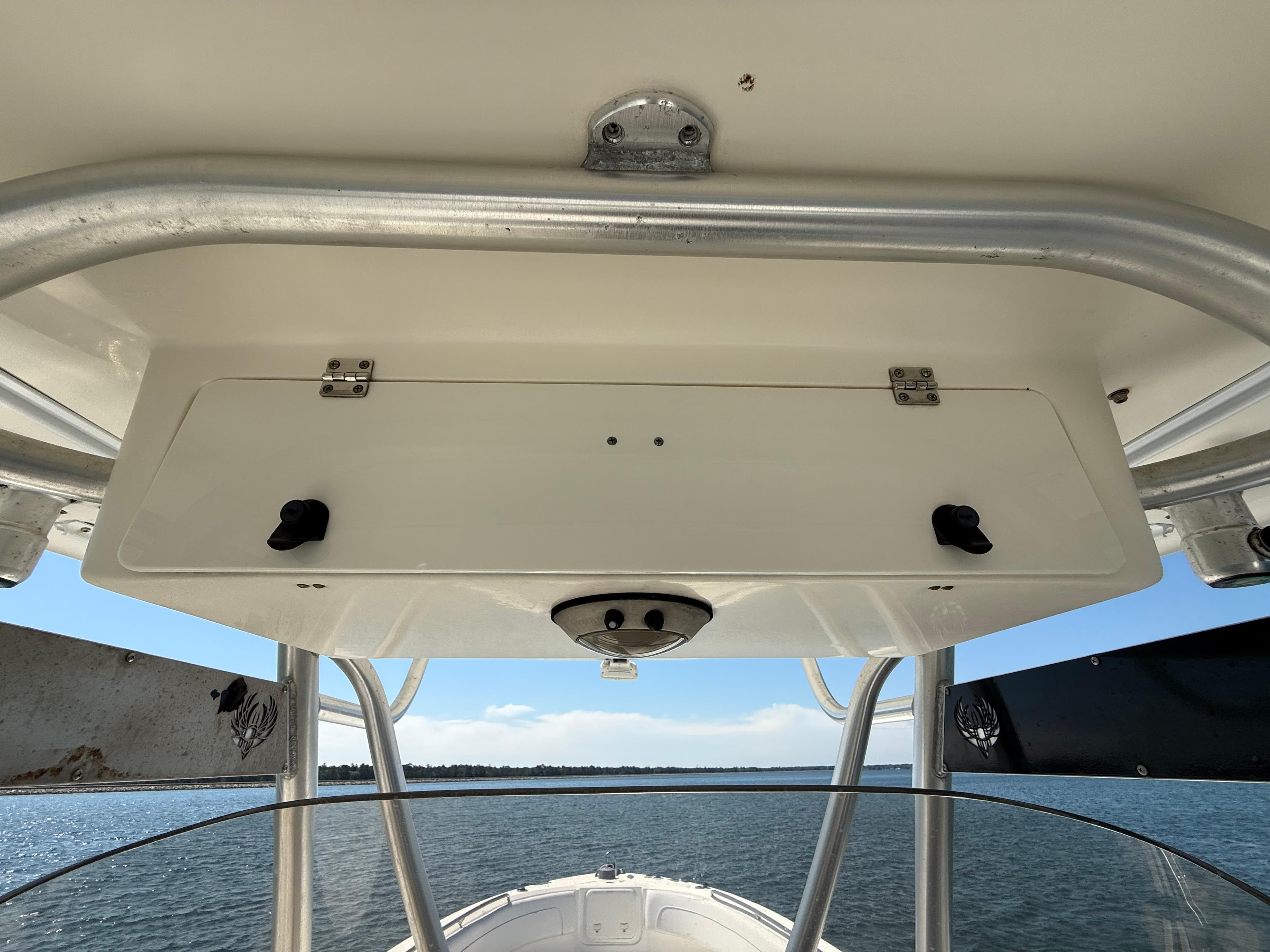 2007 Wellcraft 352 Tournament boat console with storage compartment, viewed from the deck.