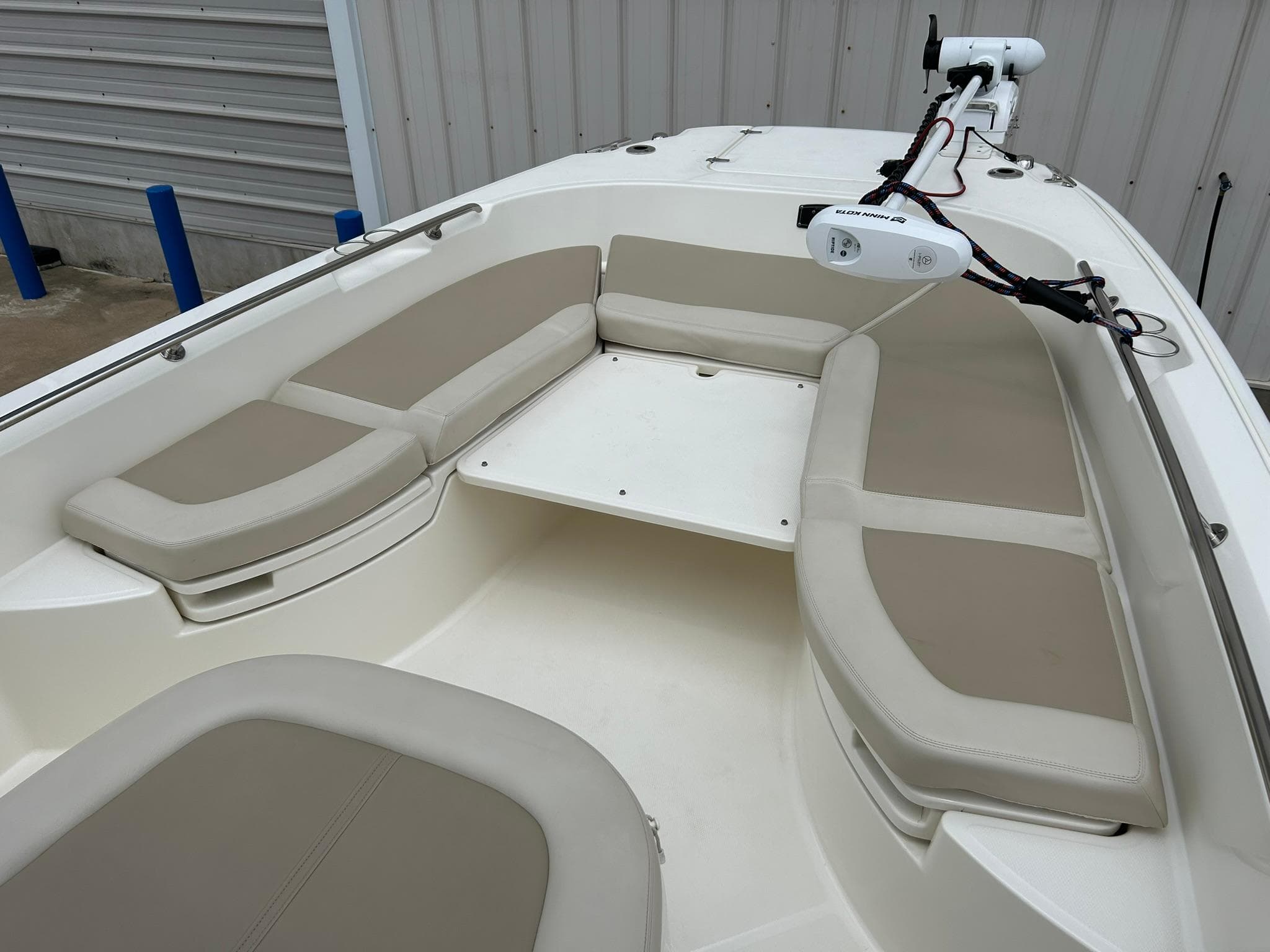 2017 Boston Whaler 270 Dauntless boat interior with cushioned seating and mounted equipment.
