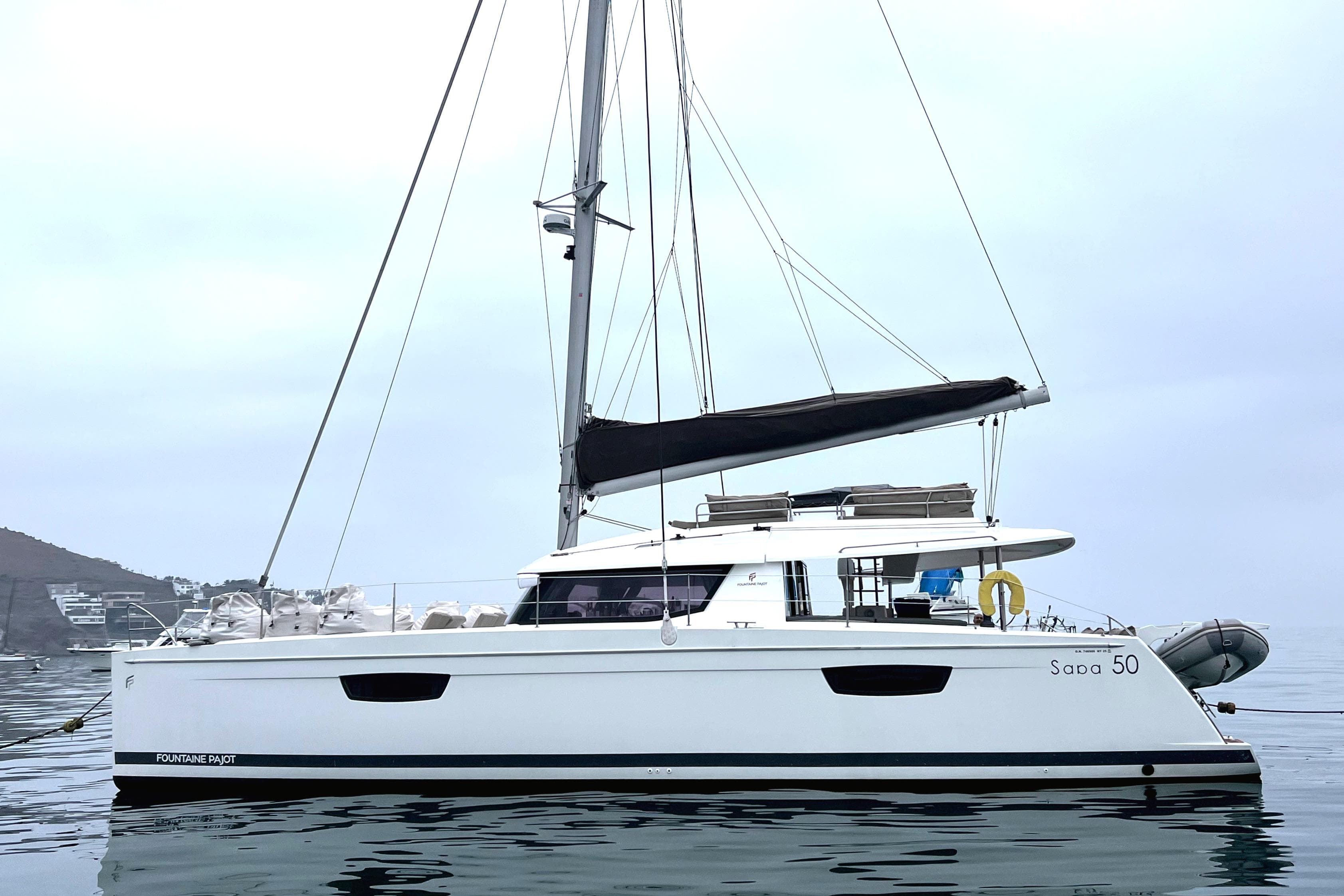 2016 Fountaine Pajot SABA 50 catamaran on calm water, side view.