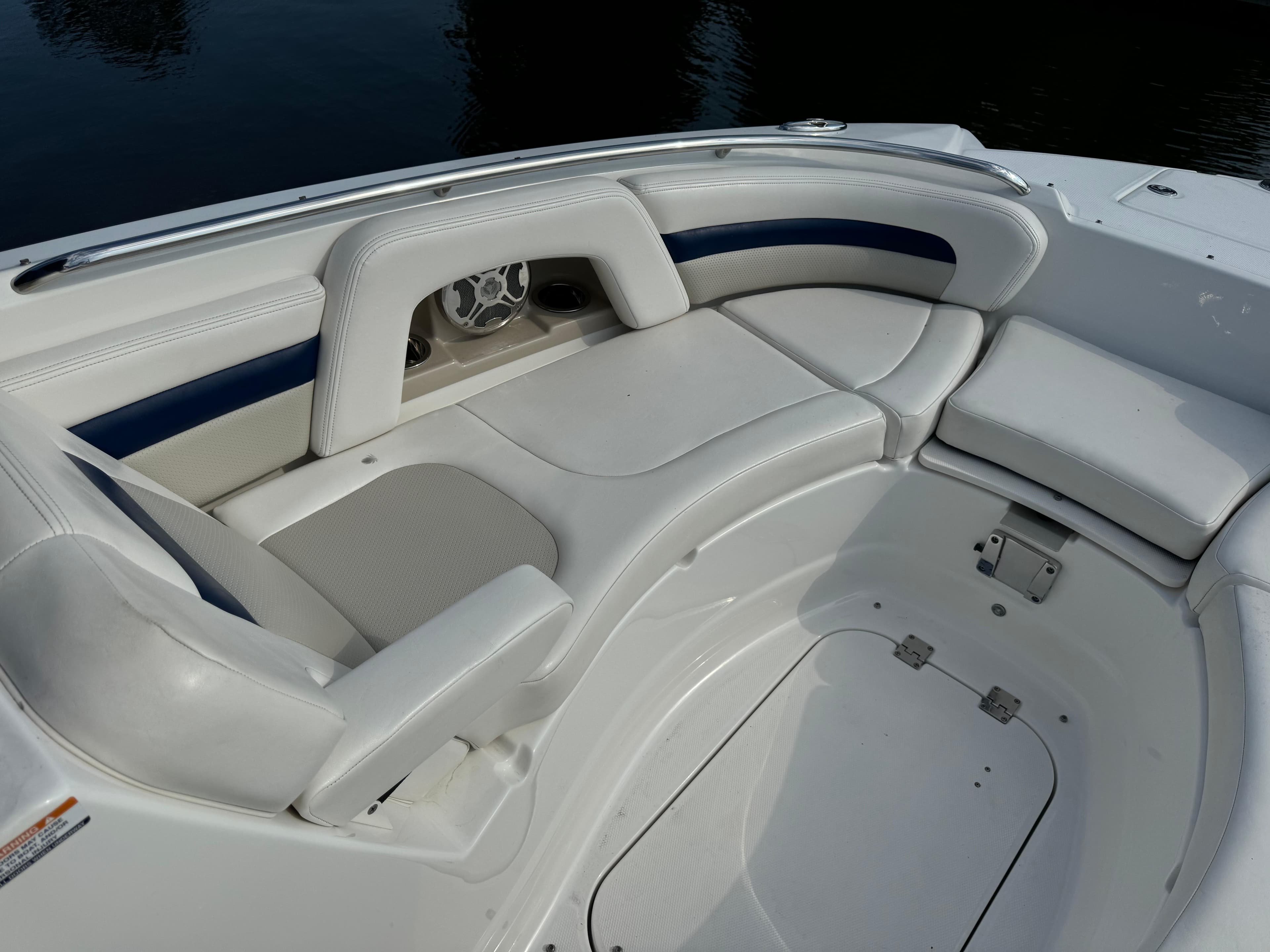 2012 Chaparral 264 Sunesta boat interior with white cushioned seating.