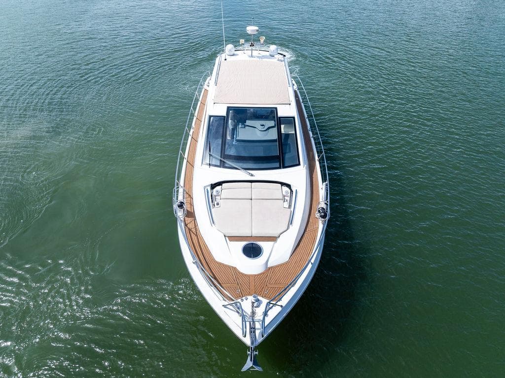 2014 Cranchi 56 HT yacht on calm water, aerial view.
