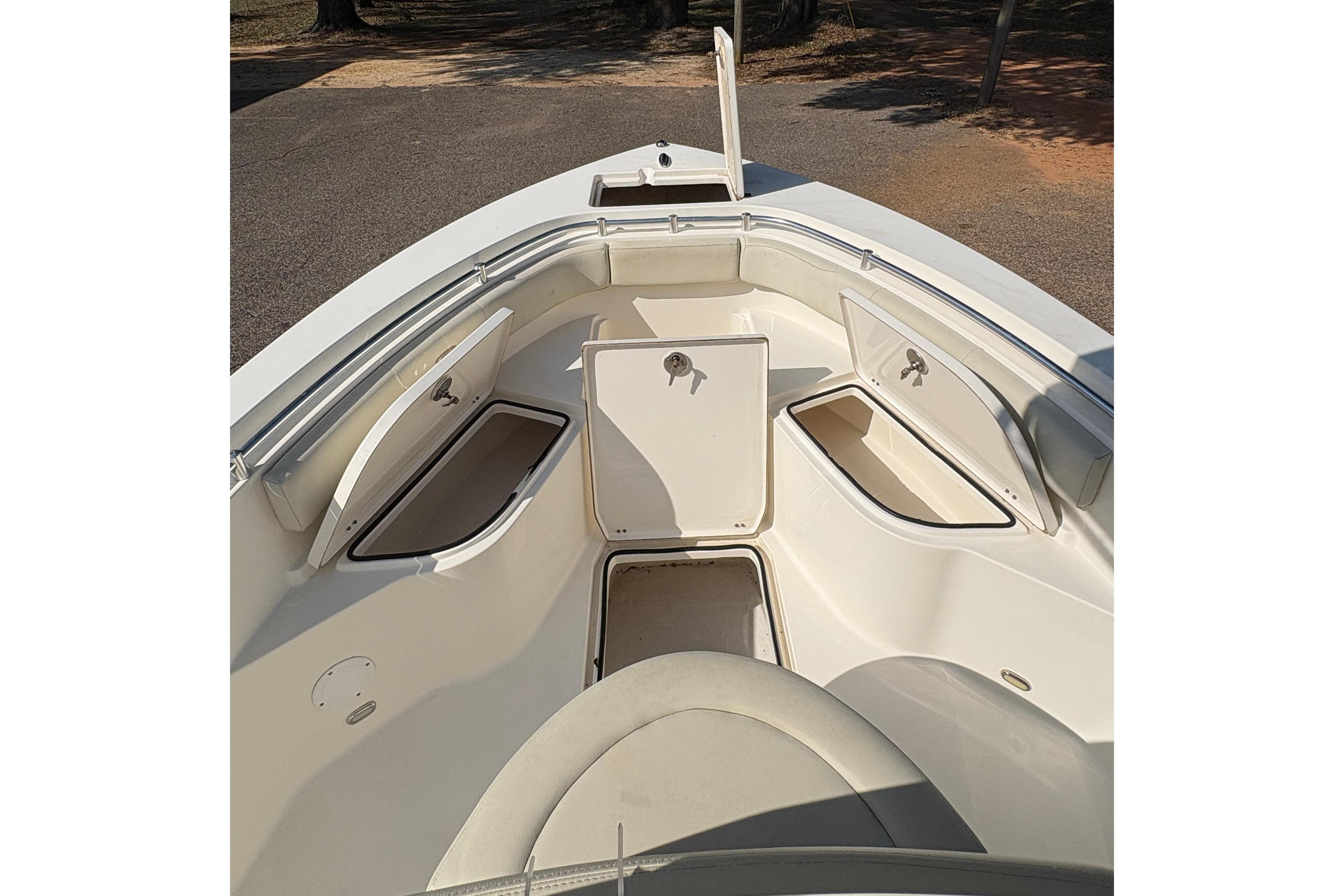2021 Cobia 237 Center Console boat interior with open storage compartments.
