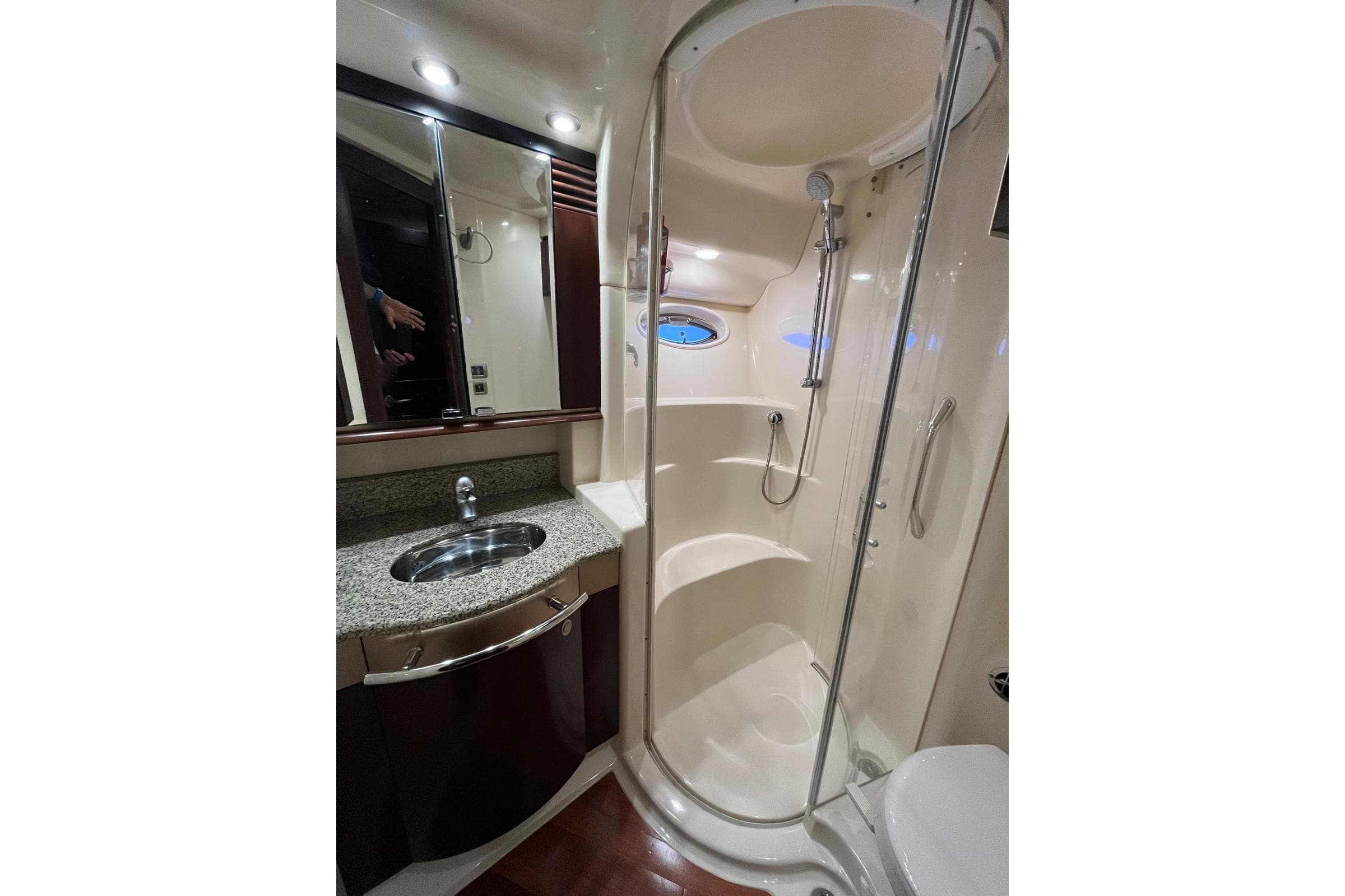 Luxurious bathroom in 2006 Sea Ray 52 Sedan Bridge yacht with shower and sink.
