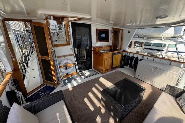 Spacious deck of 1990 Californian 45 Motor Yacht with seating and storage.