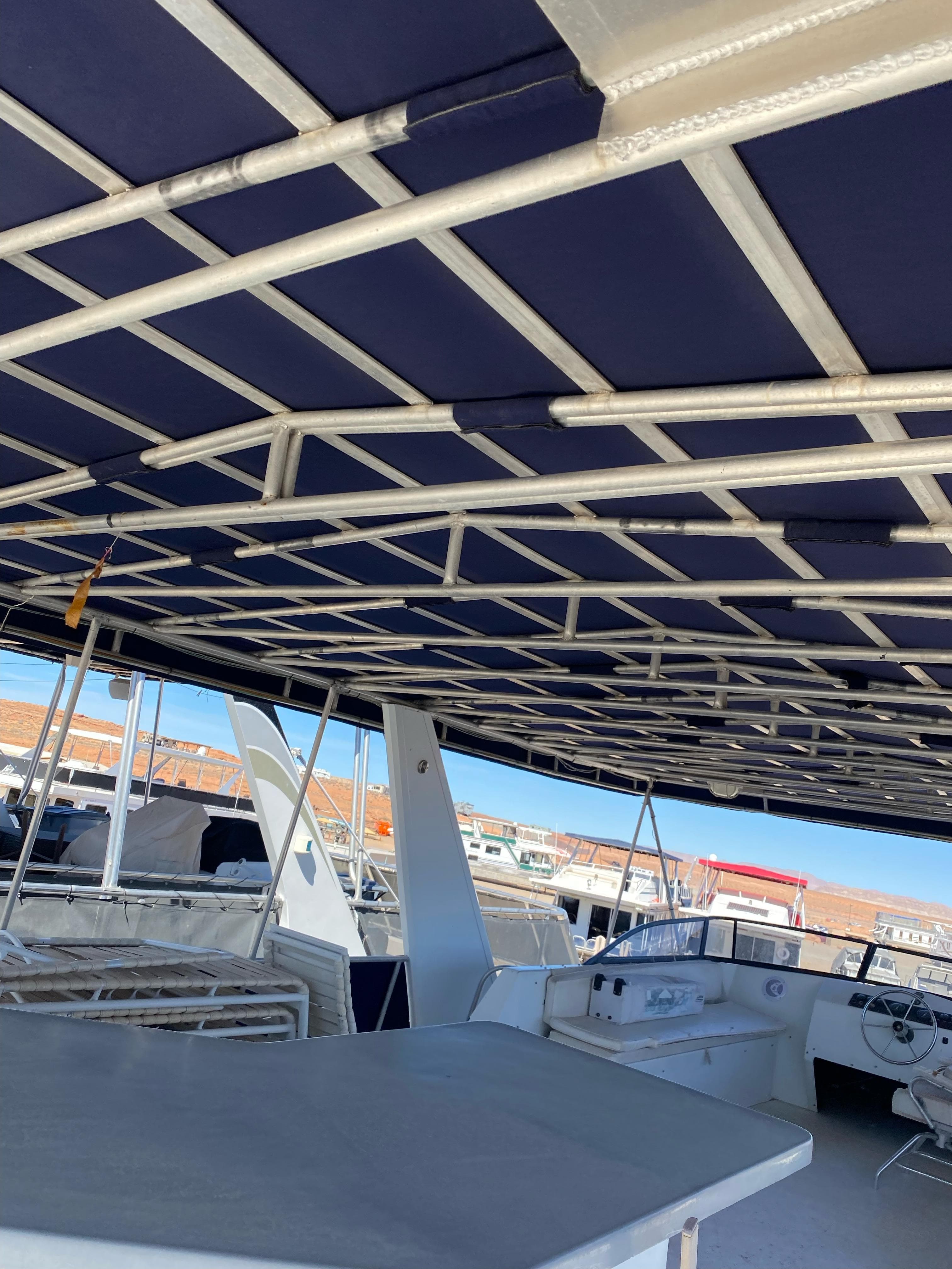 2001 Stardust Cruisers Summer Dreamin' Trip boat interior with blue canopy and seating area.