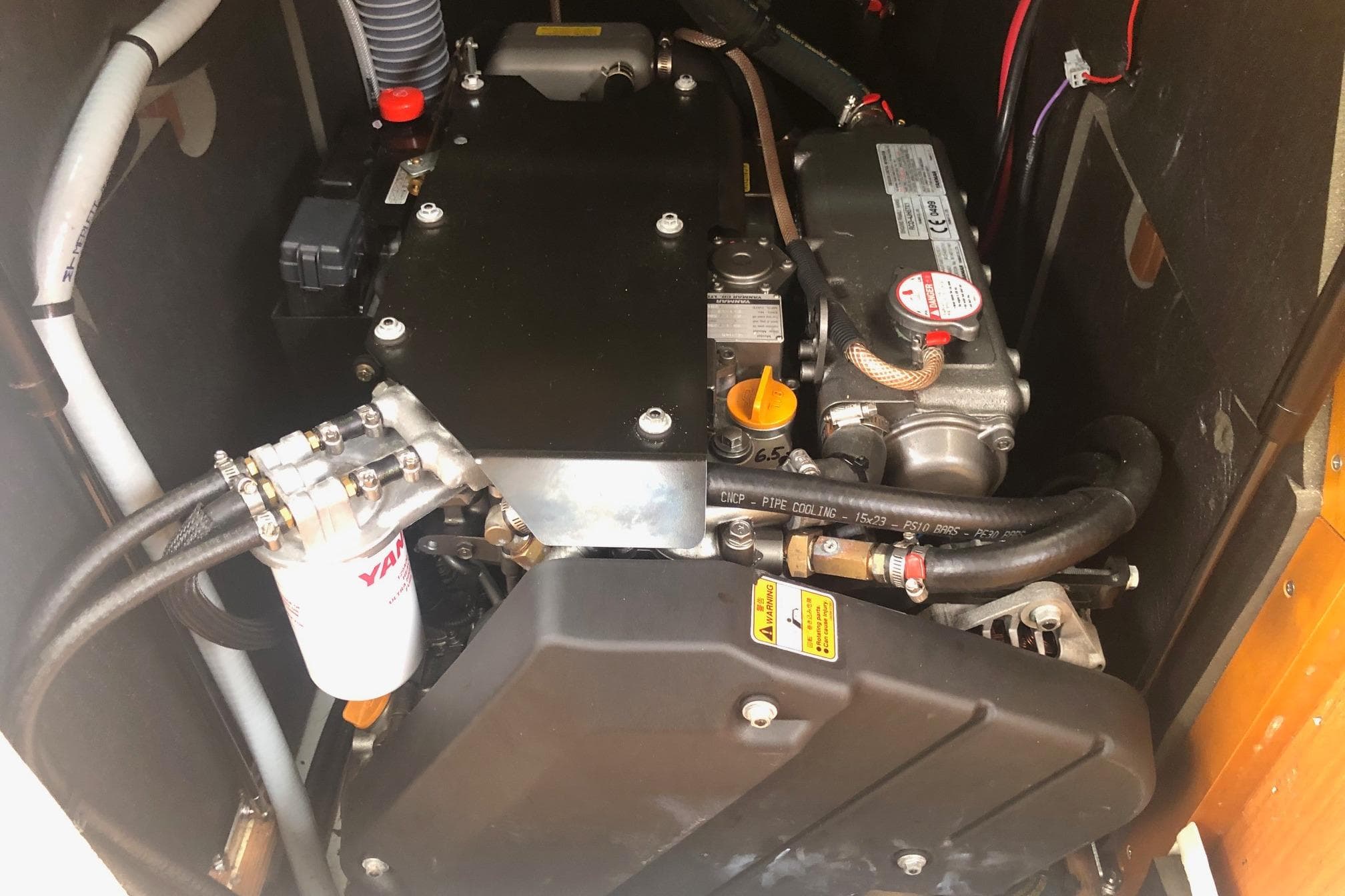 Engine compartment of a 2017 Jeanneau Sun Odyssey 41 DS sailboat.