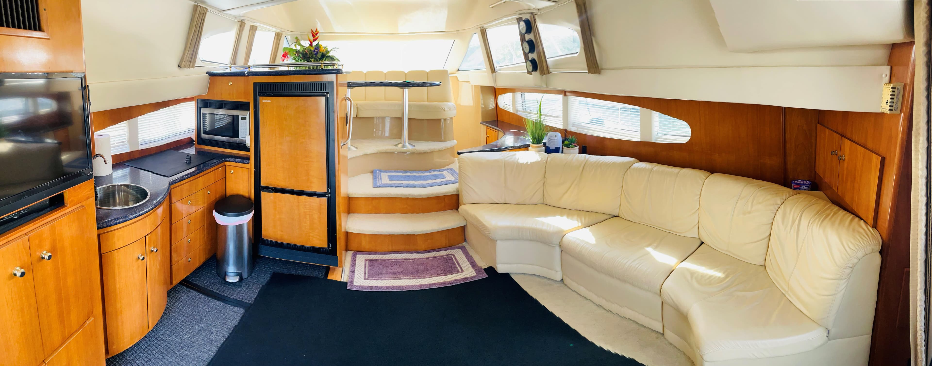 Interior of 2002 Carver 410 Sport Sedan with kitchen and seating area.