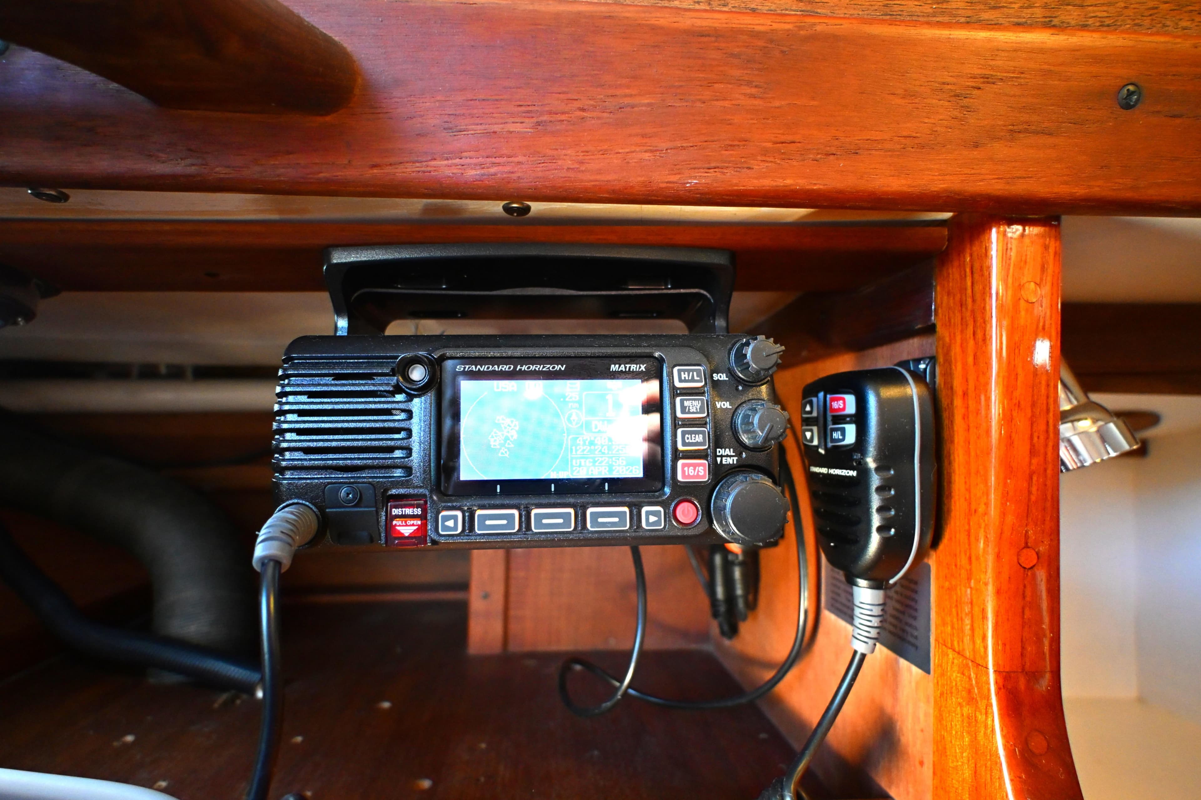 Marine radio equipment inside a 1980 Tartan 37 sailboat, featuring a Standard Horizon device.
