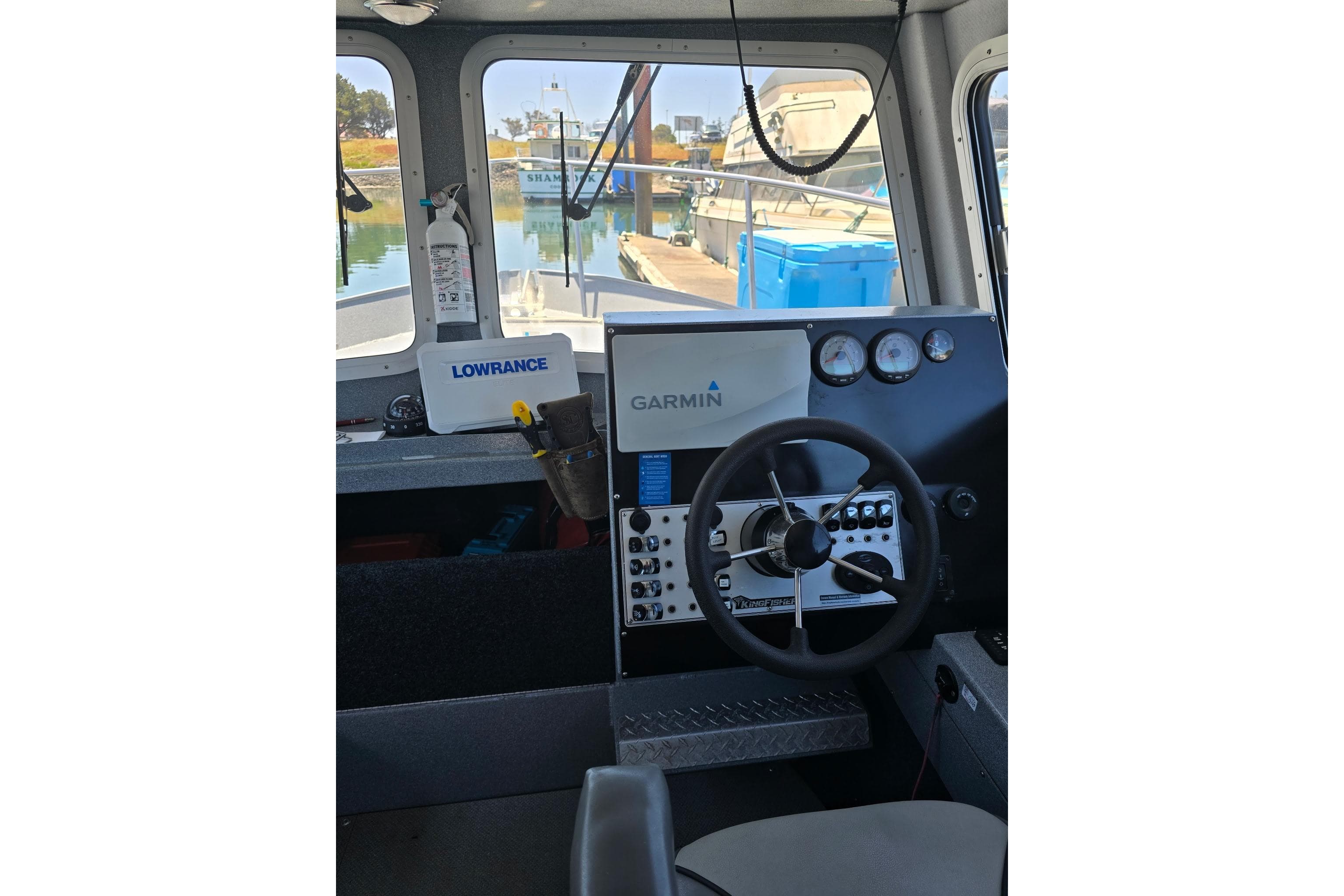 Interior of 2021 KingFisher 2825 Coastal Express boat with Garmin and Lowrance equipment.