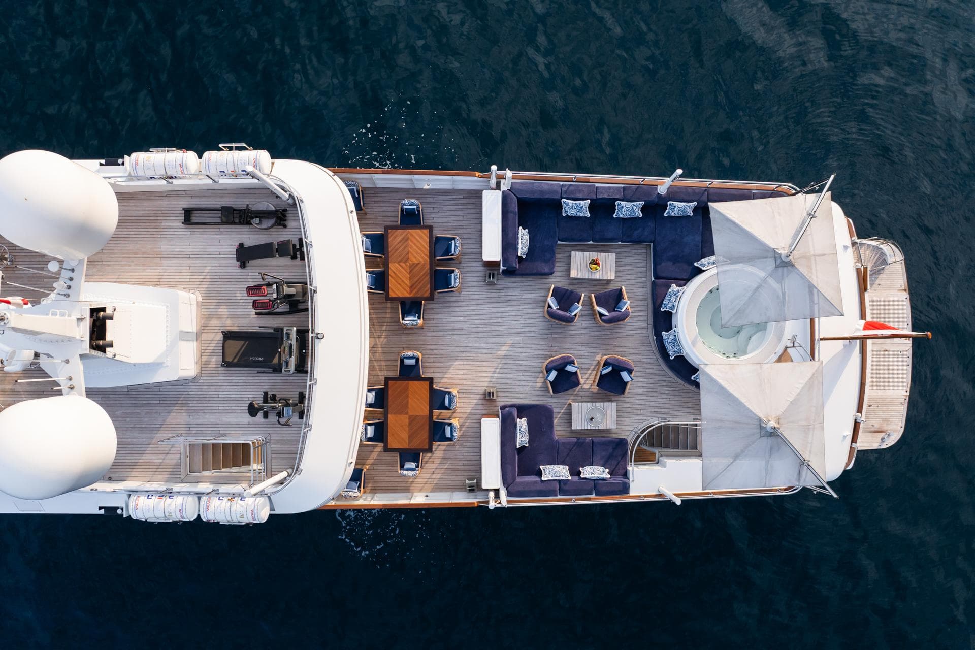 Aerial view of 1982 Feadship yacht deck with seating and tables.