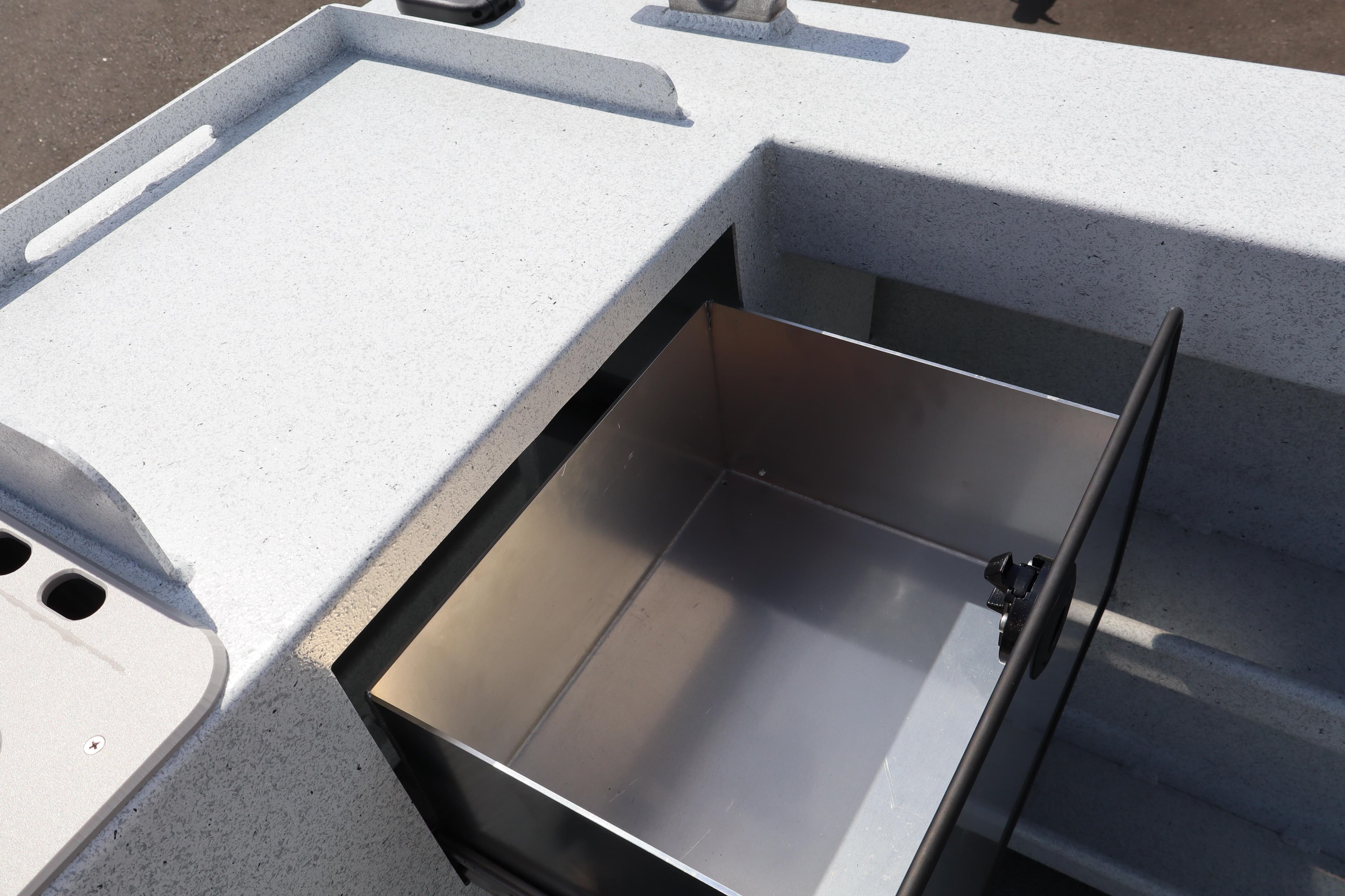 Storage compartment on 2026 KingFisher 2825 Coastal Express boat, open and empty.