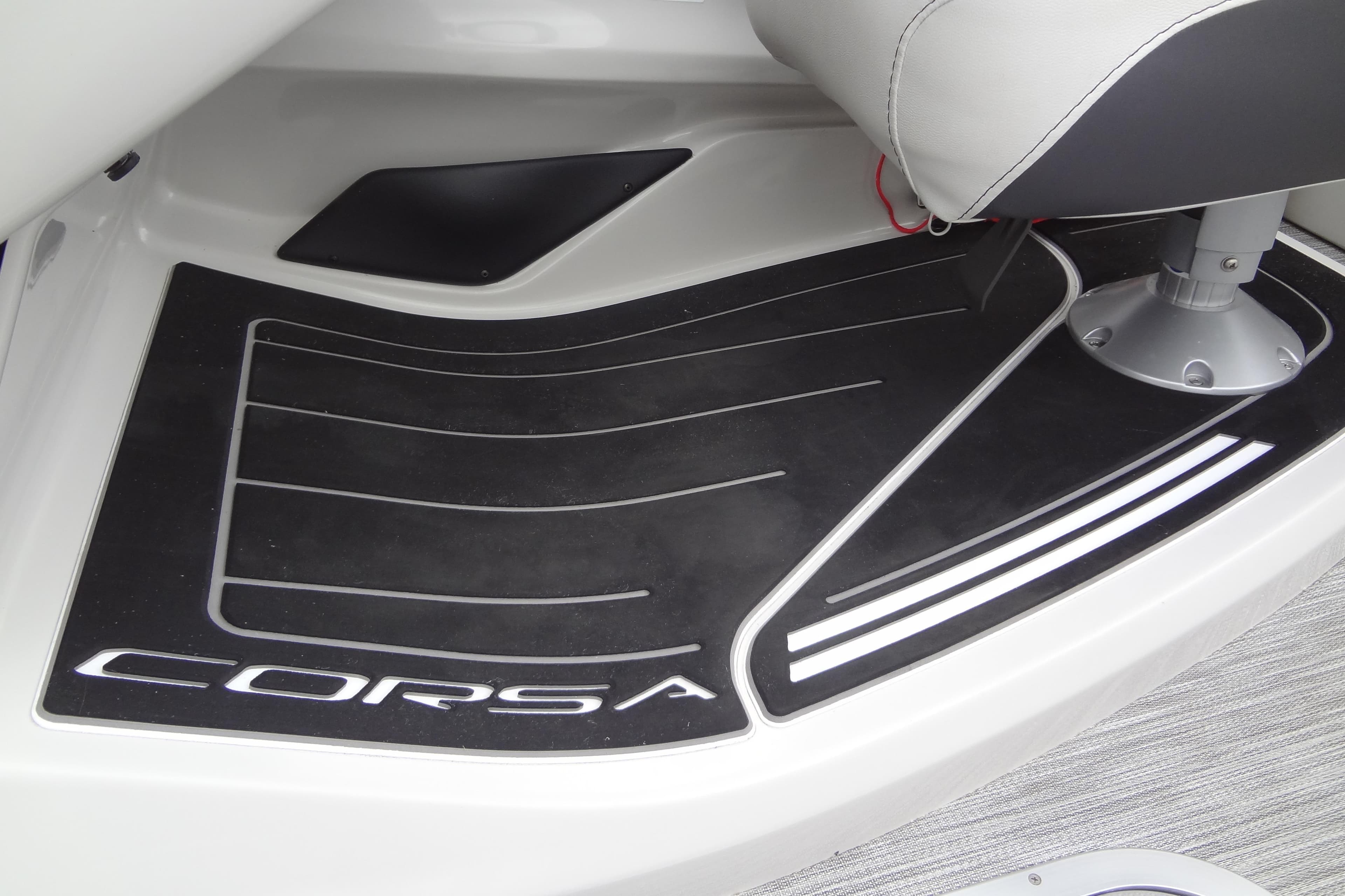 Baraletta Corsa 23 QSS 2021 boat interior with branded floor mat and seat base.