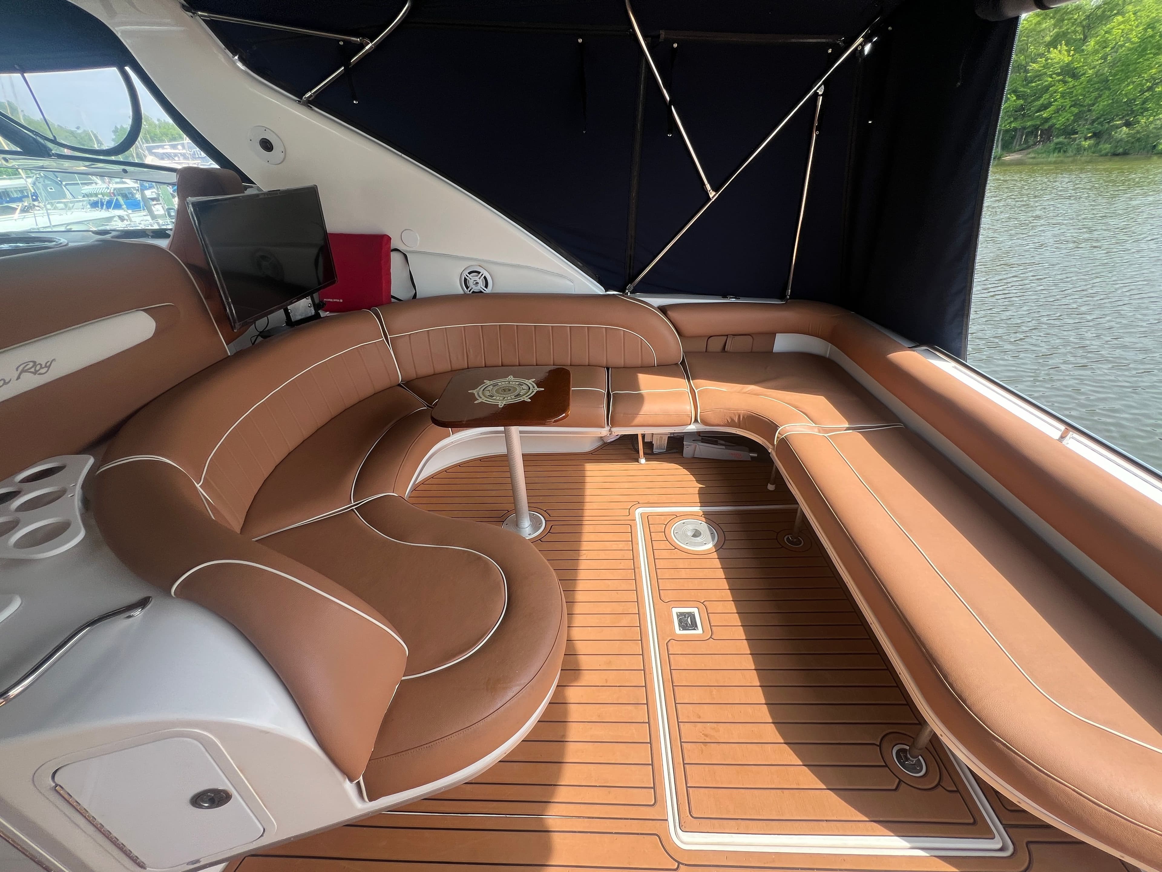 Interior of a 1997 Sea Ray 450 yacht with brown leather seating.