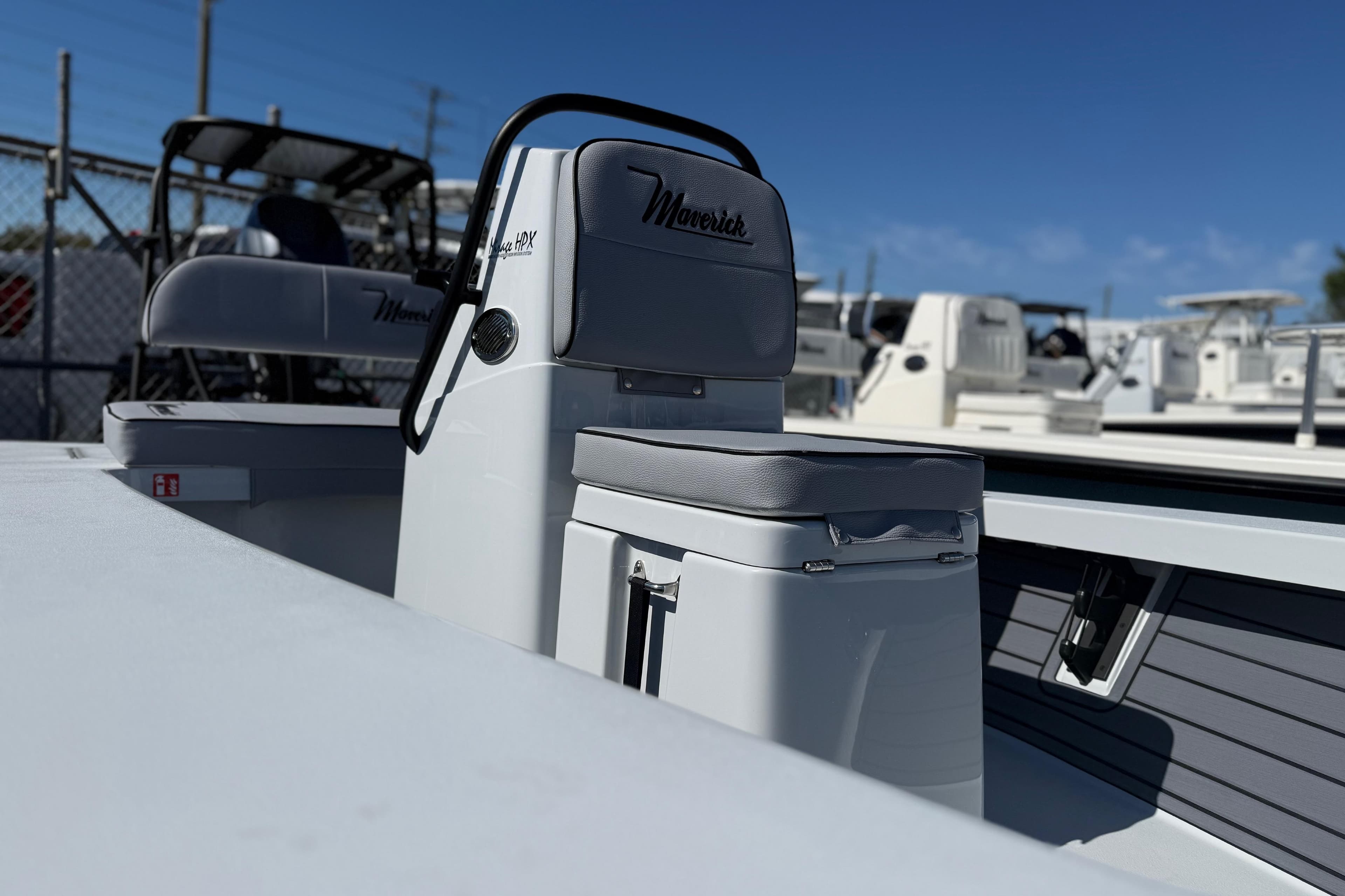 2026 Maverick 17 HPX-S boat interior with seating and console, displayed outdoors.