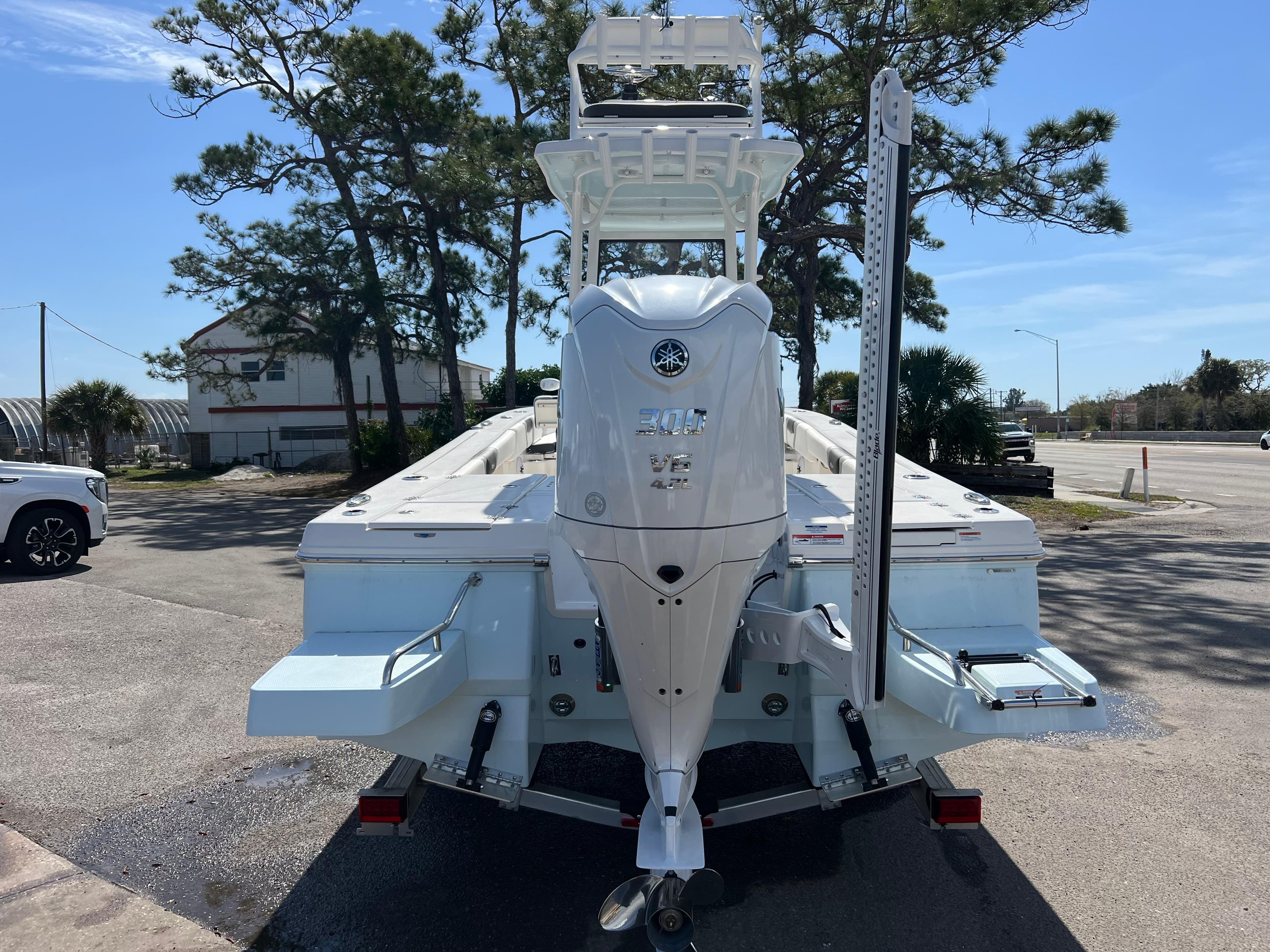 2024 Robalo 246 Sky Deck boat, rear view, parked on a sunny day.