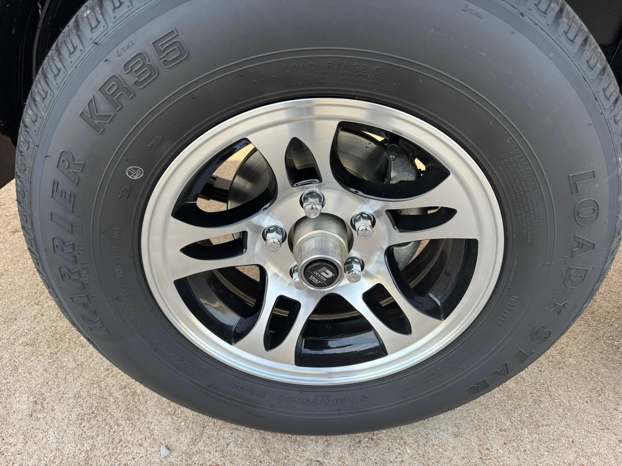 2025 Regal LS4 Surf wheel with Load Star KR35 tire on concrete surface.