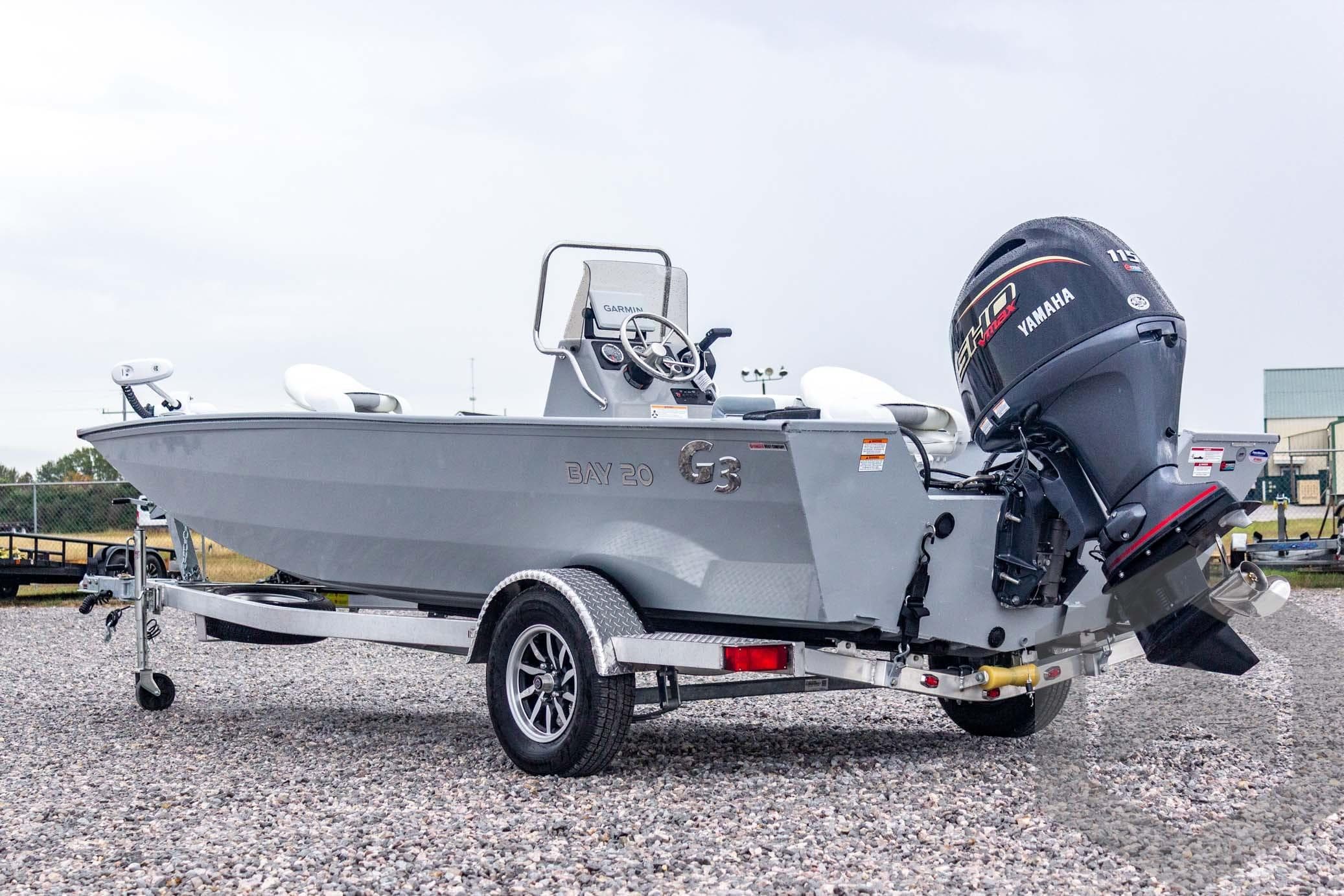 2026 G3 Bay 20 boat on trailer with Yamaha outboard motor, parked on gravel.