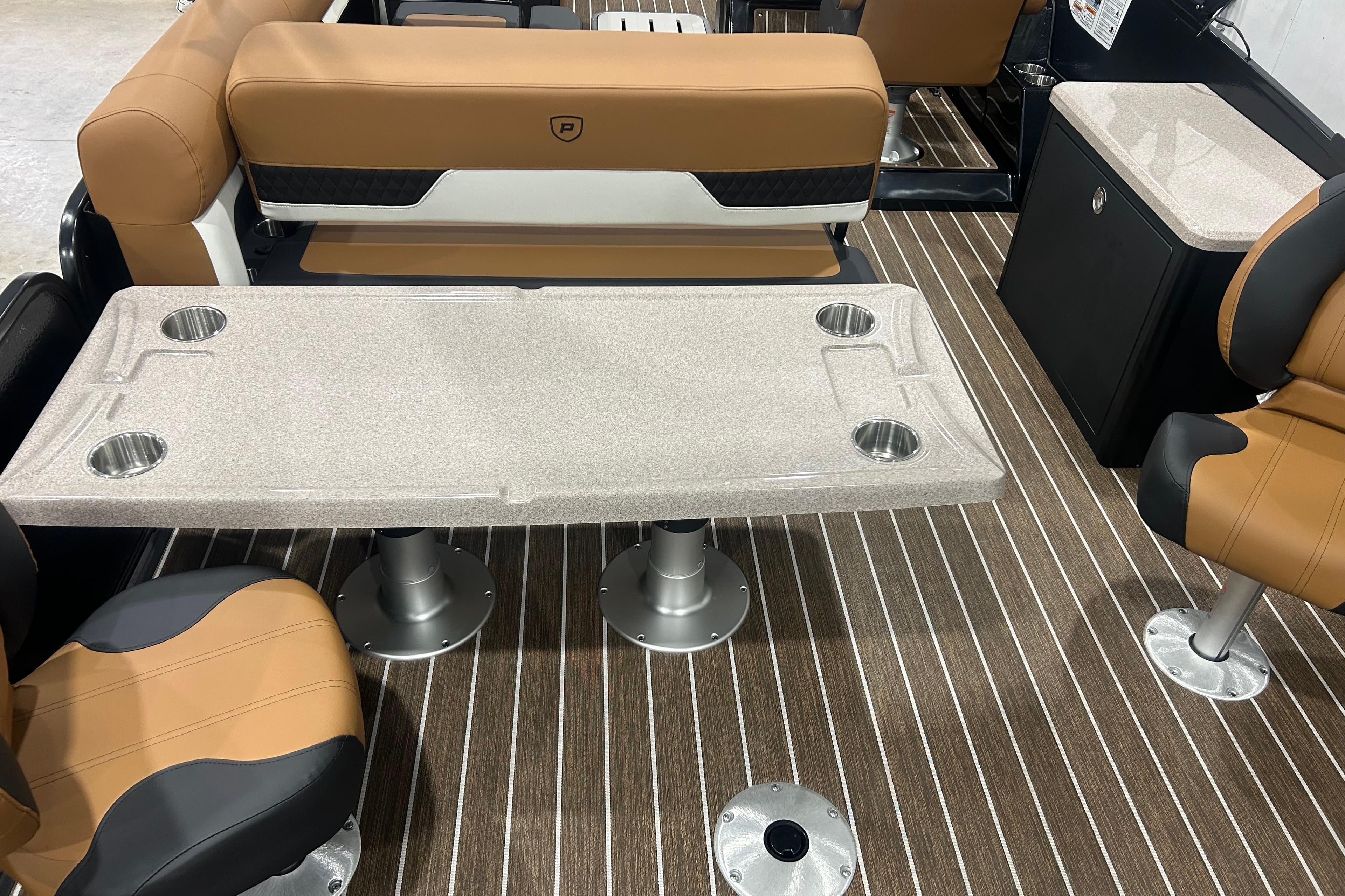 Luxurious interior of 2026 Premier 250 Solaris RS with elegant seating and table design.