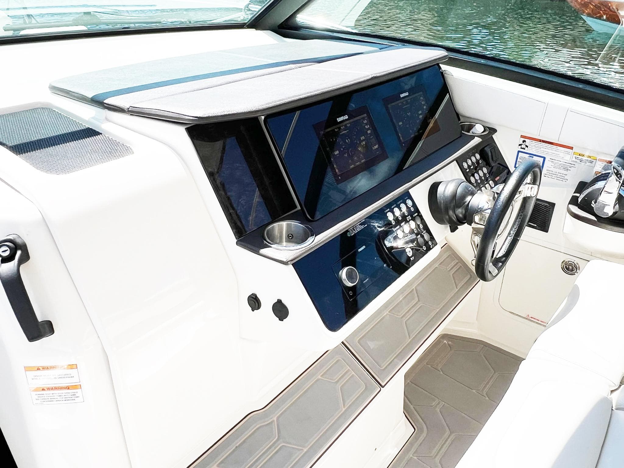 2019 Sea Ray Sundancer 320 Outboard helm with modern controls and navigation displays.