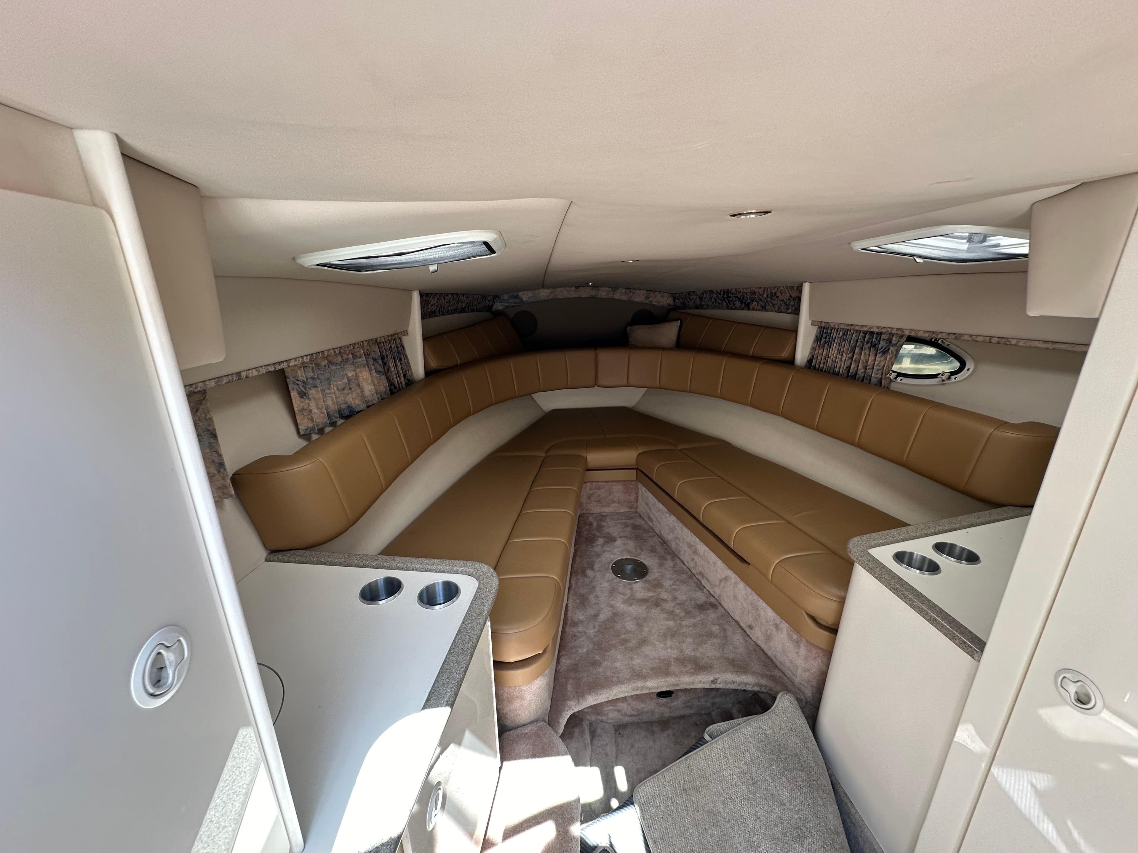 Interior of 2000 Formula 330 SS boat with tan seating and modern design.
