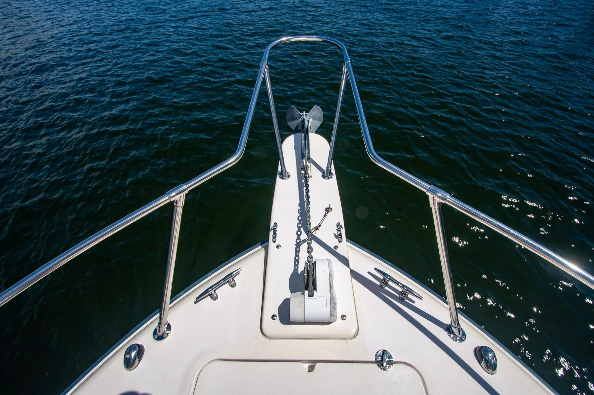 Bow view of 2004 Grady-White Sailfish 282 on water, featuring anchor and railing.